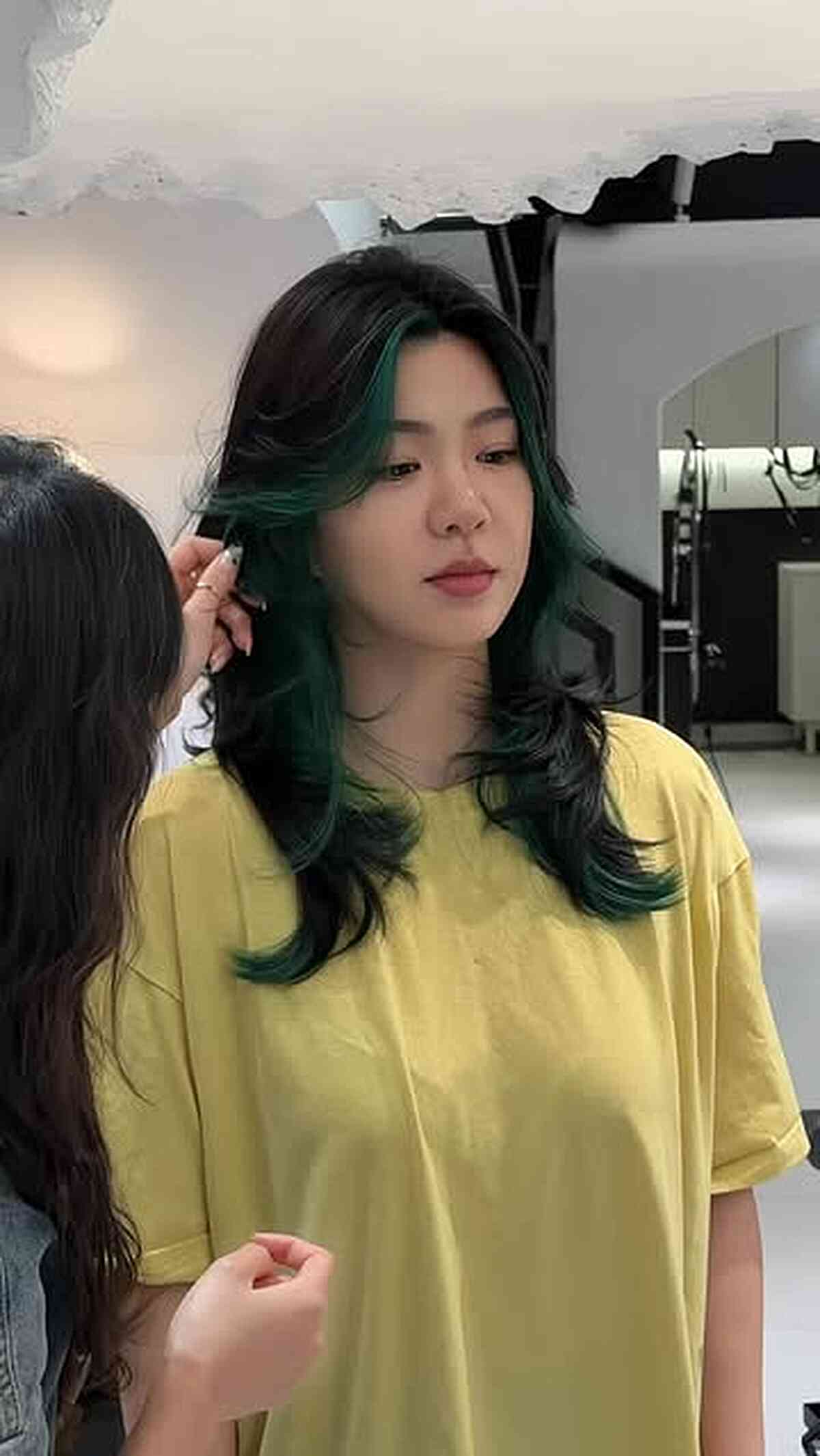 Trendy Hush Cut with Vibrant Green Highlights