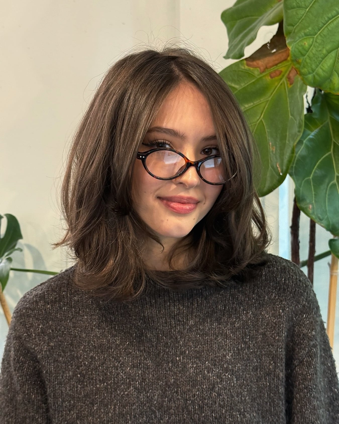 Layered brown lob with side bangs and glasses