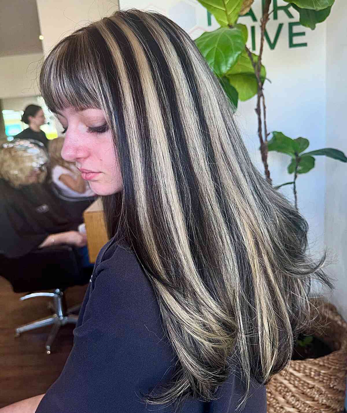 Bold Skunk Stripe Hair with Long Layers