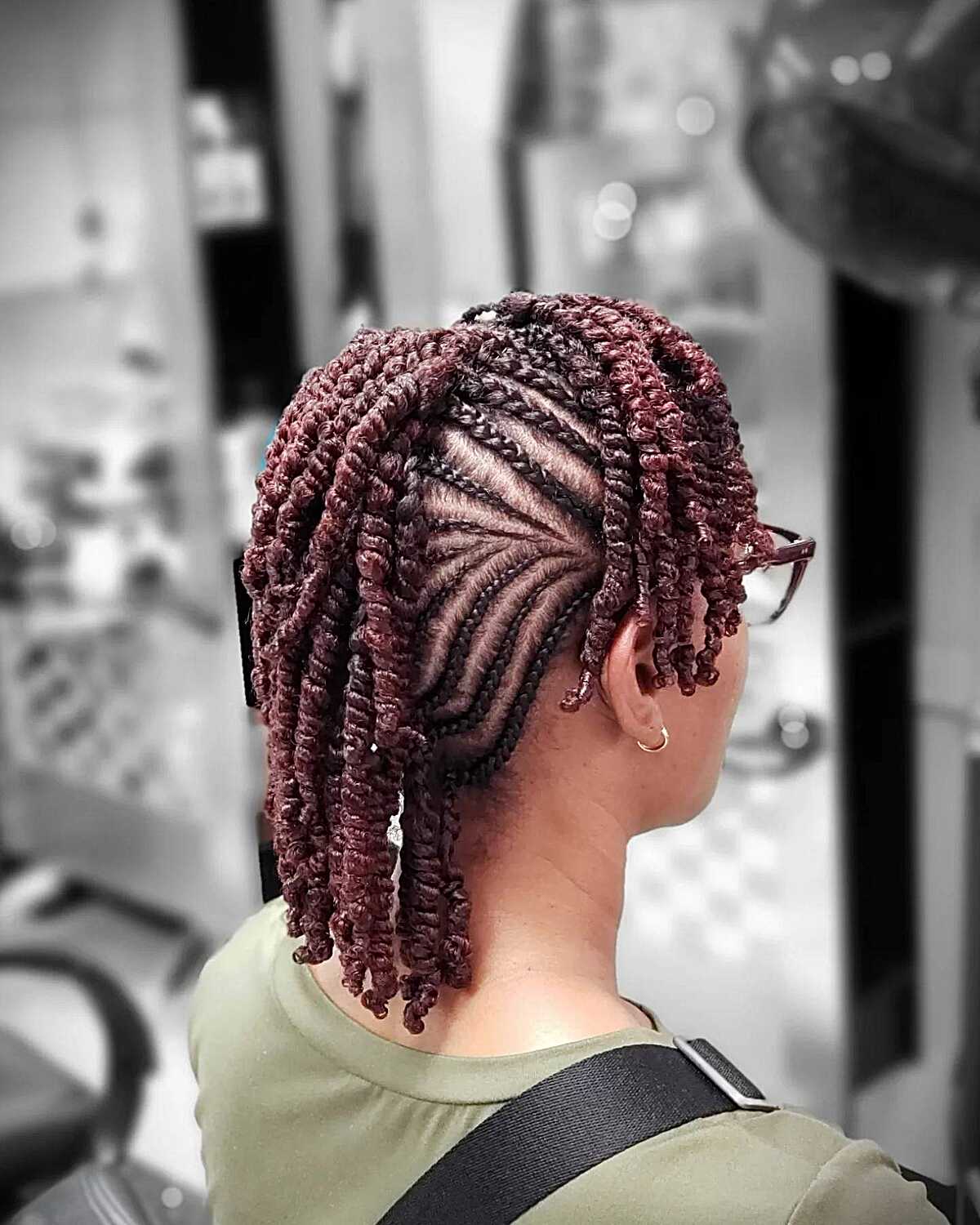 Burgundy cornrow mohawk with twisted curly extensions