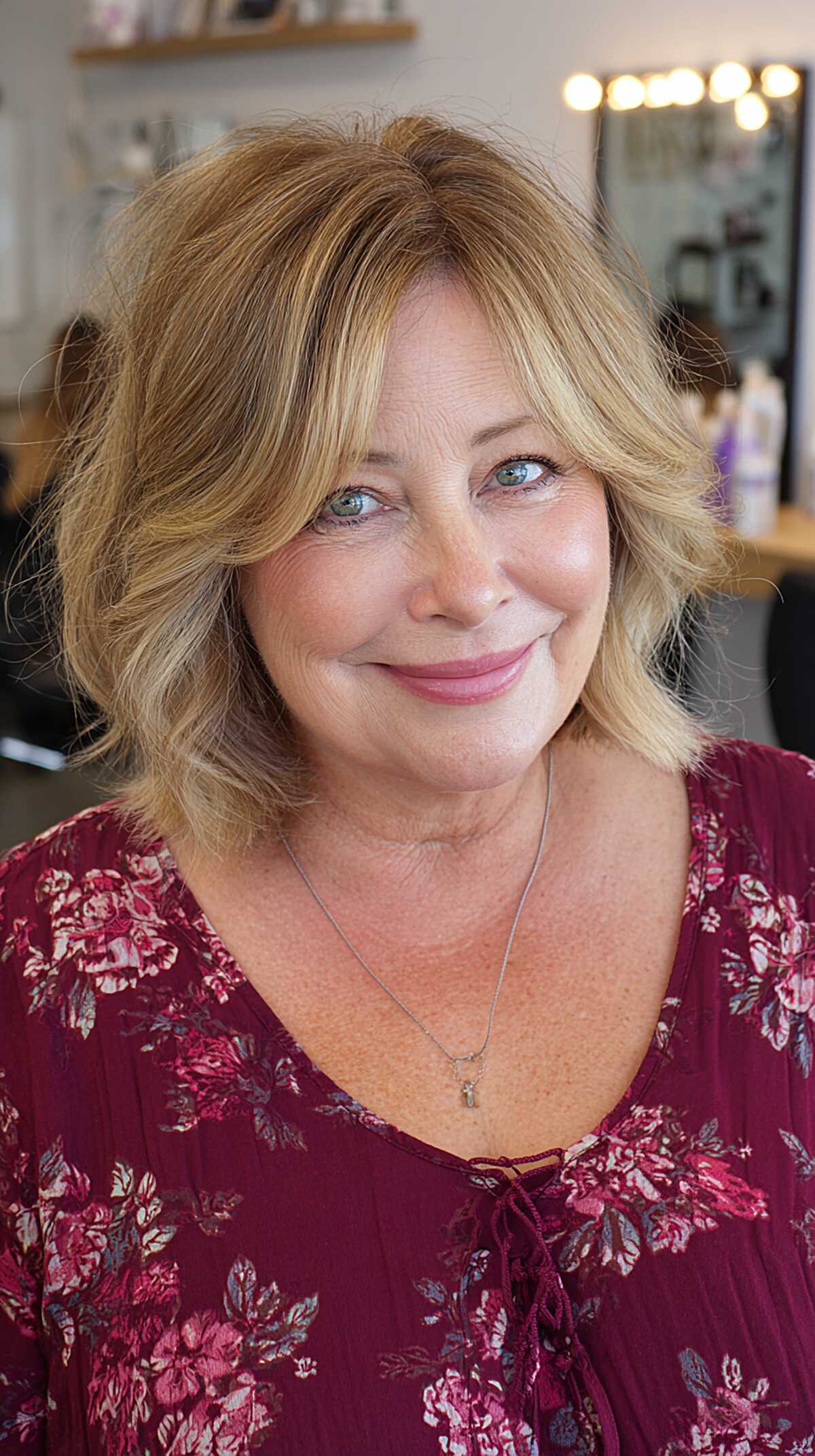 Butter blonde layered bob with darker root shadow