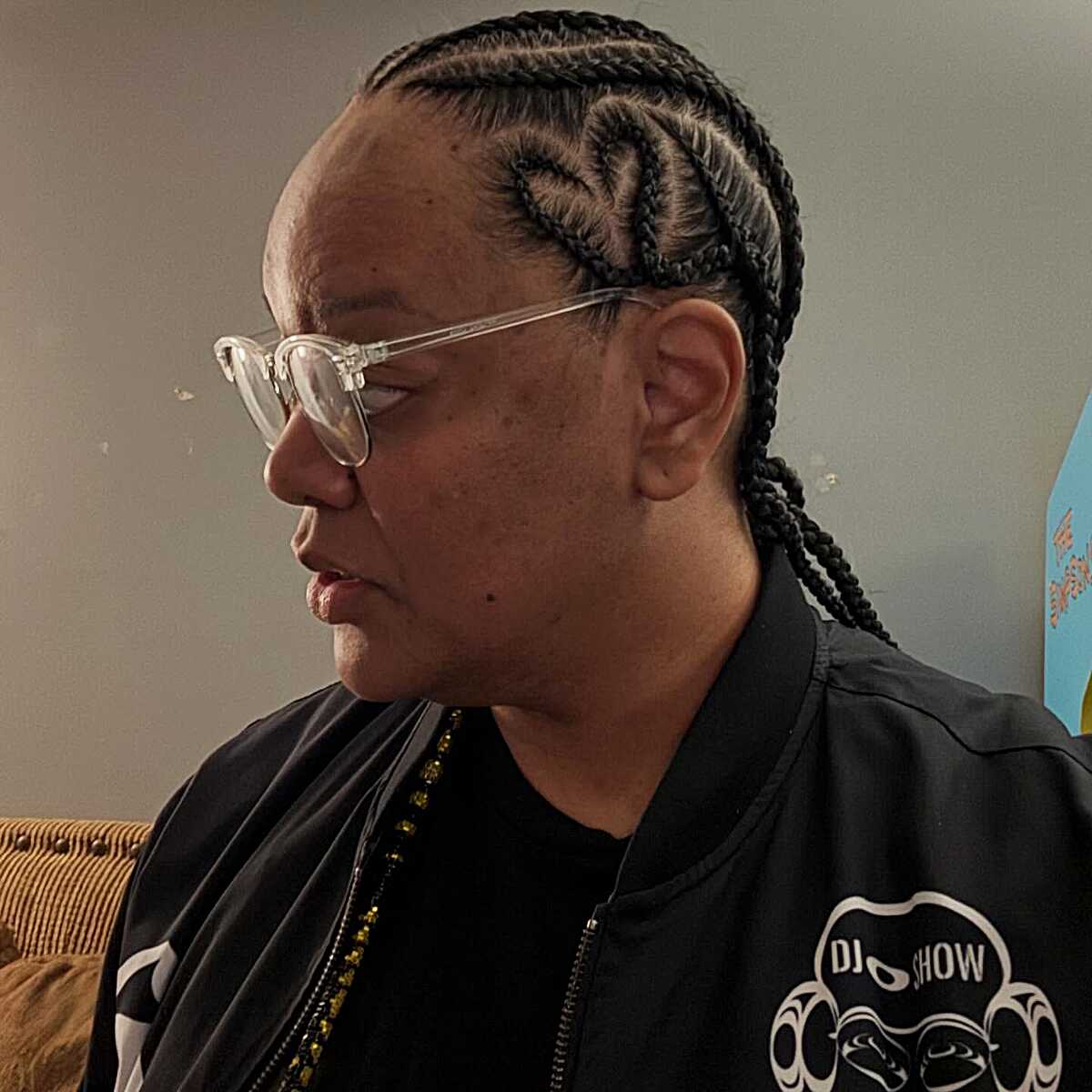 S-curved cornrows braided back in black