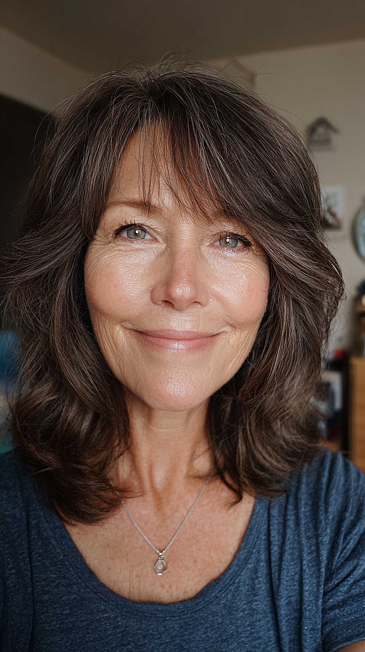 Cool ash brown shoulder-length waves with curtain fringe