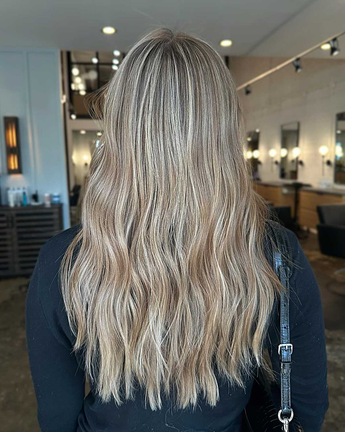 Long textured ashy blonde layers with cool dimensional tones