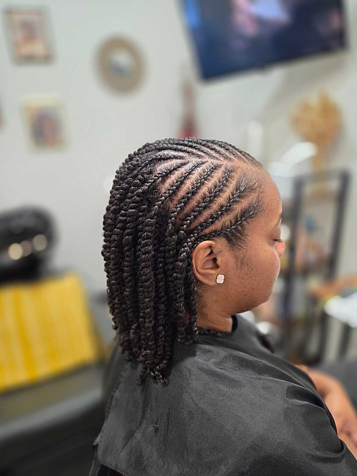 Short cornrow-to-twist bob style in natural black