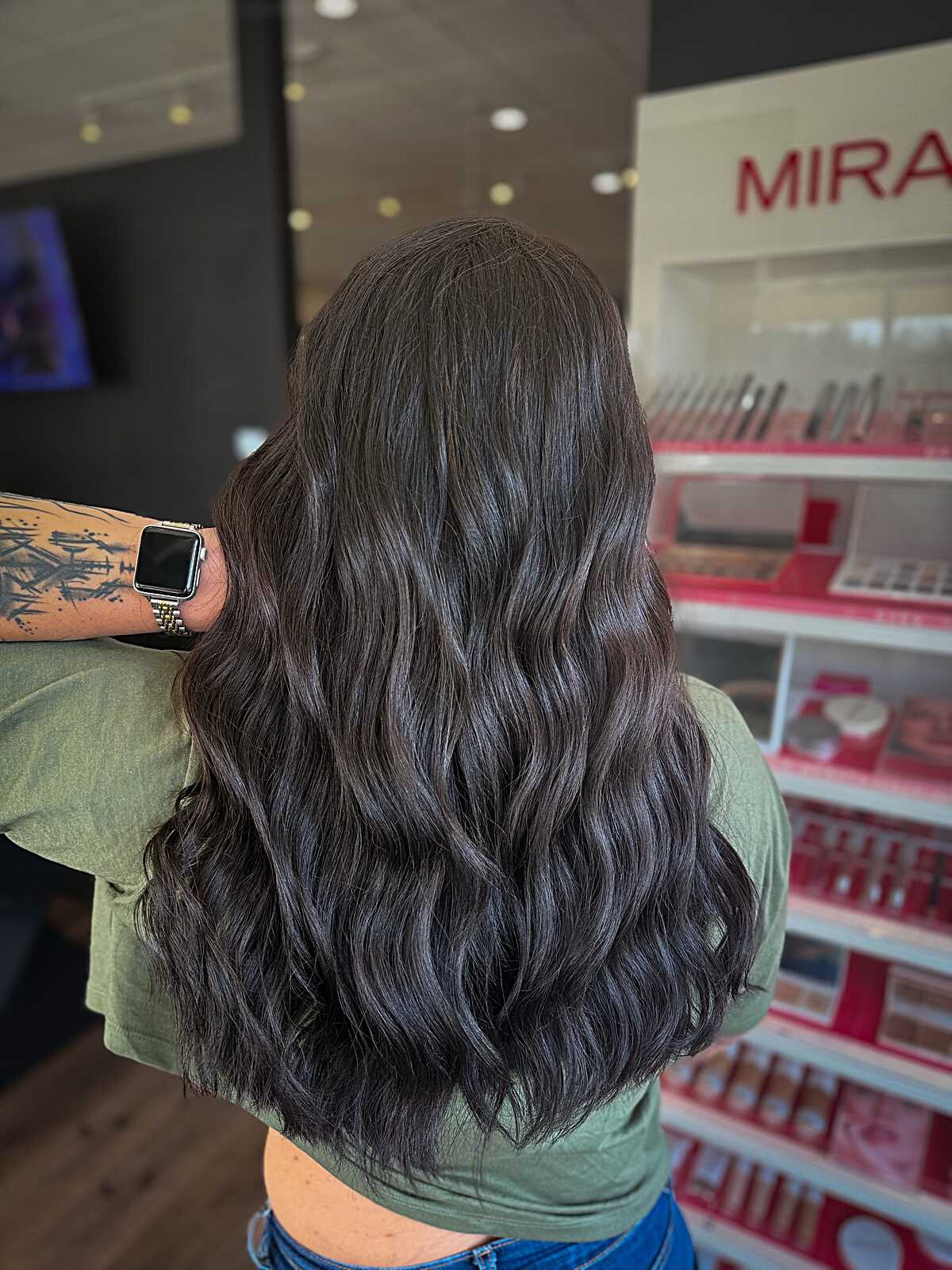 Deep dark chocolate brunette waves with cool undertones