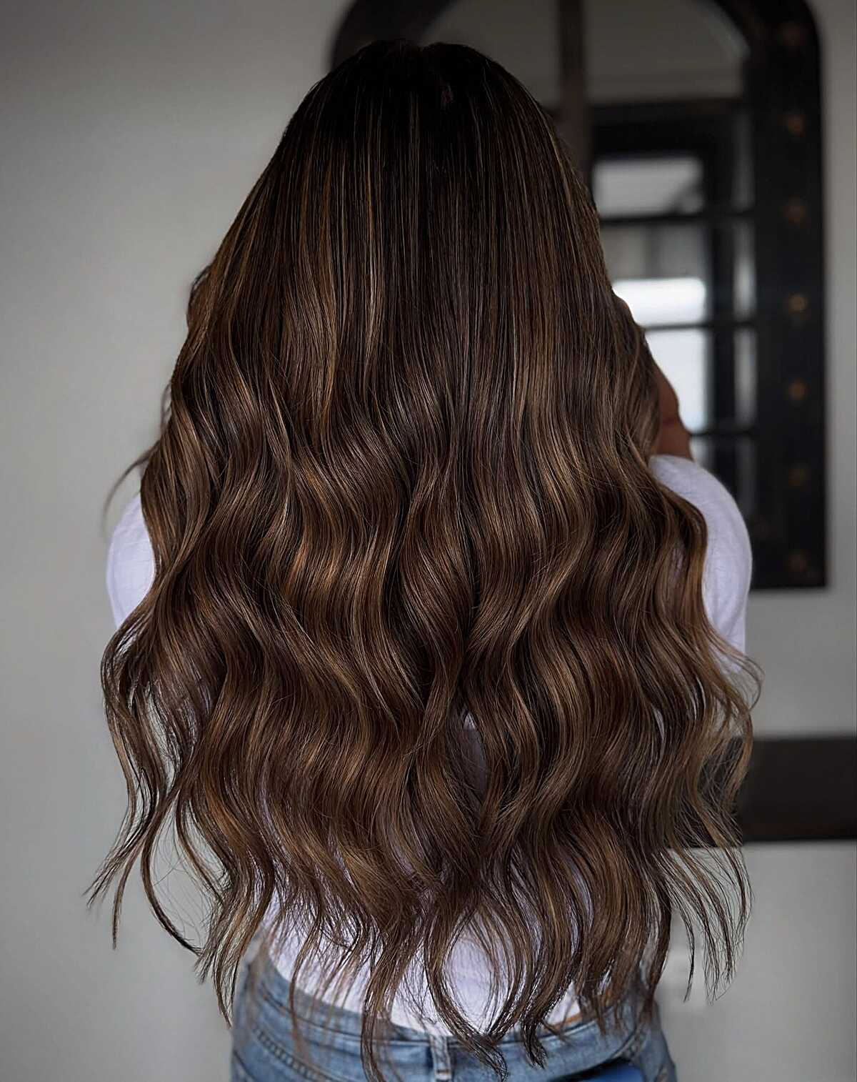 Long dark brunette waves with cinnamon-toned balayage