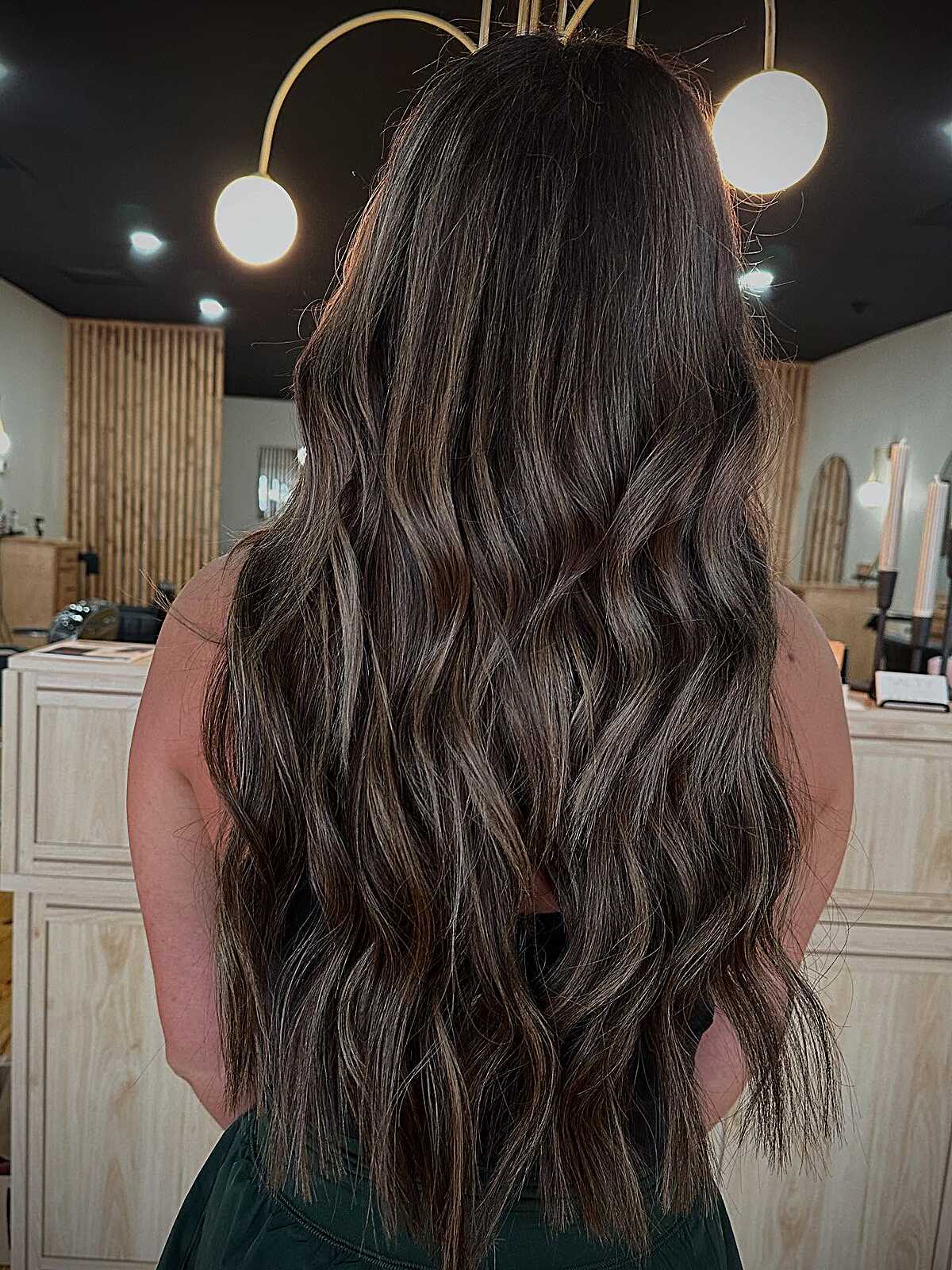 Long dark brunette with scattered lived-in highlights