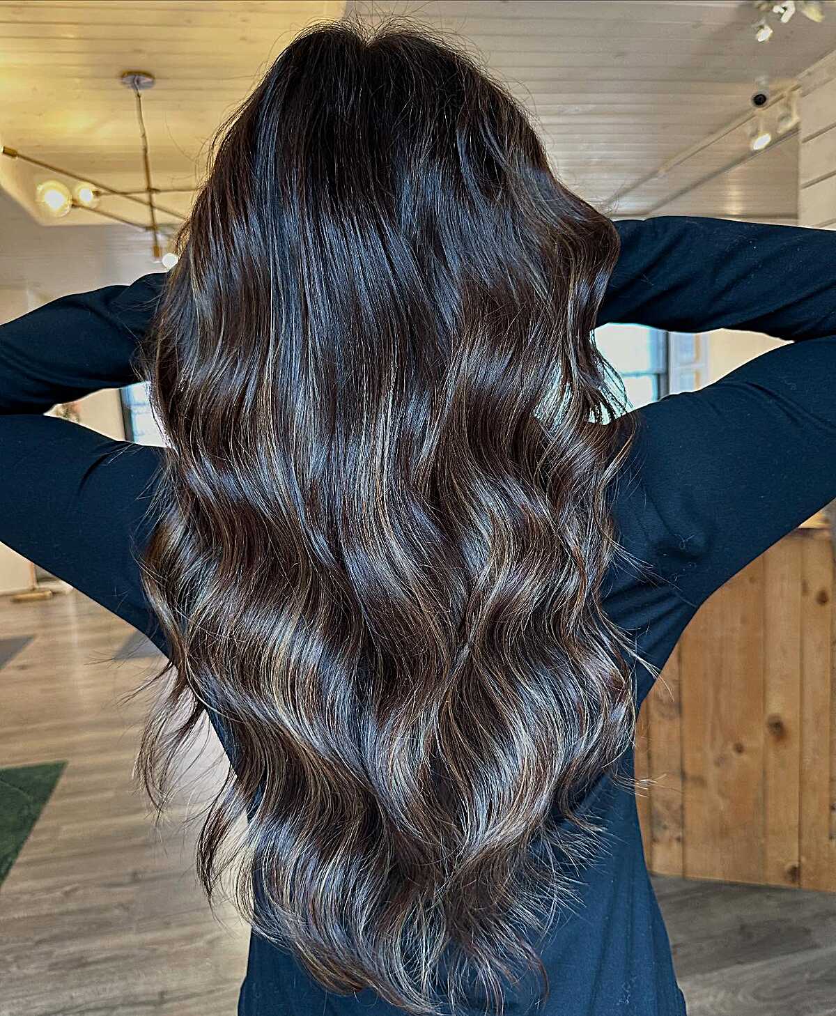 Long dark espresso waves with subtle cool-toned highlights