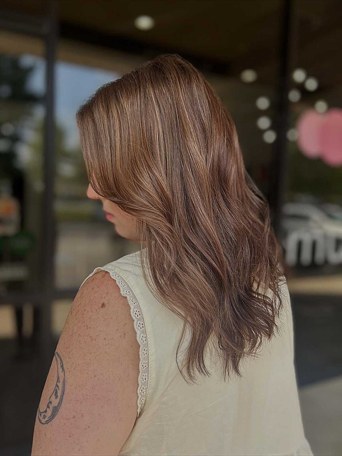 Light brunette with dusty rose copper tones throughout