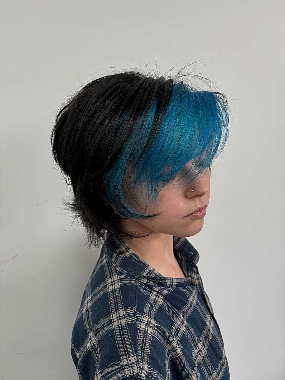 Black shaggy cut with electric blue face-framing