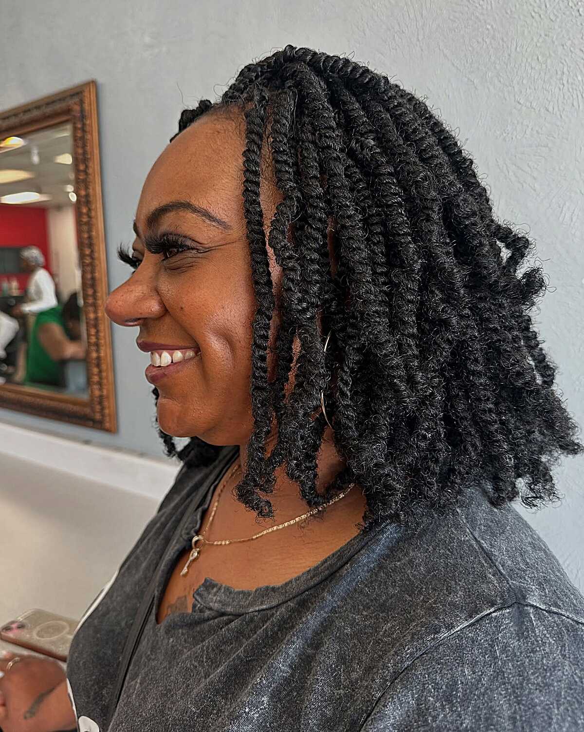 Voluminous black spring twist bob with curly texture