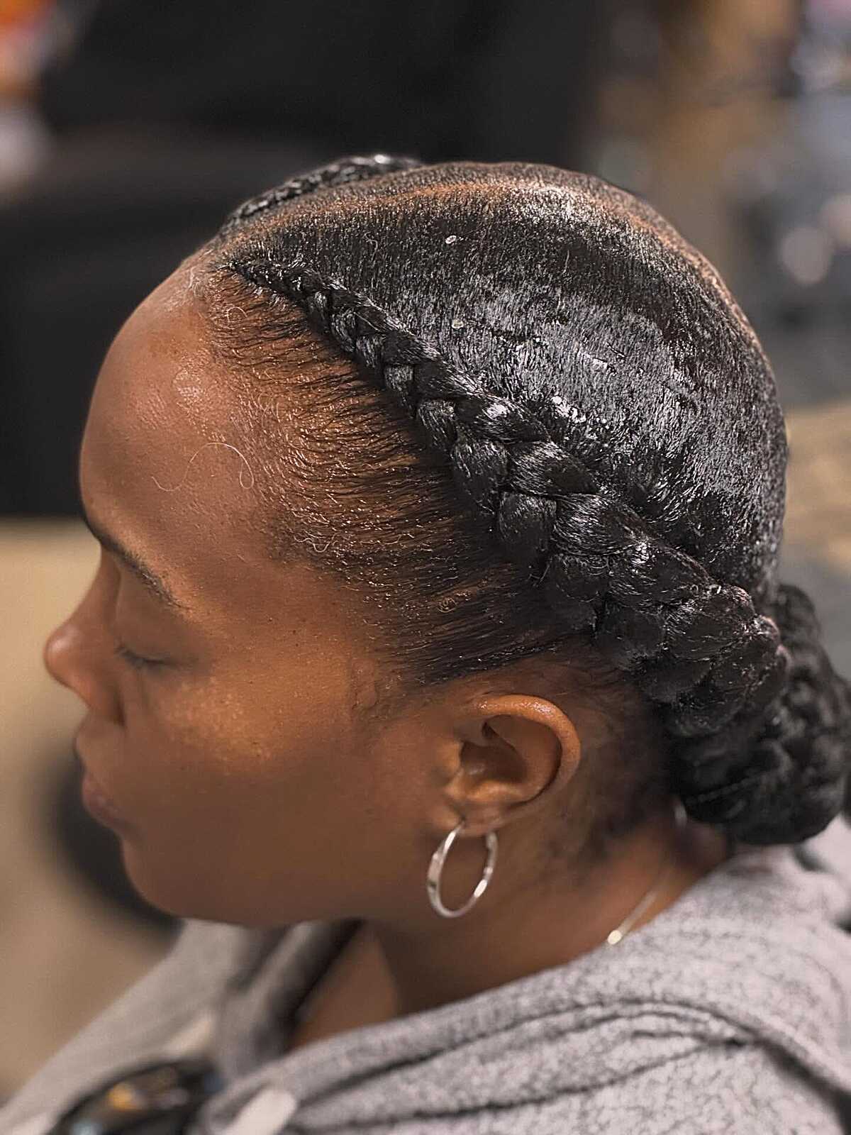 Two-strand halo braid tucked into a low bun