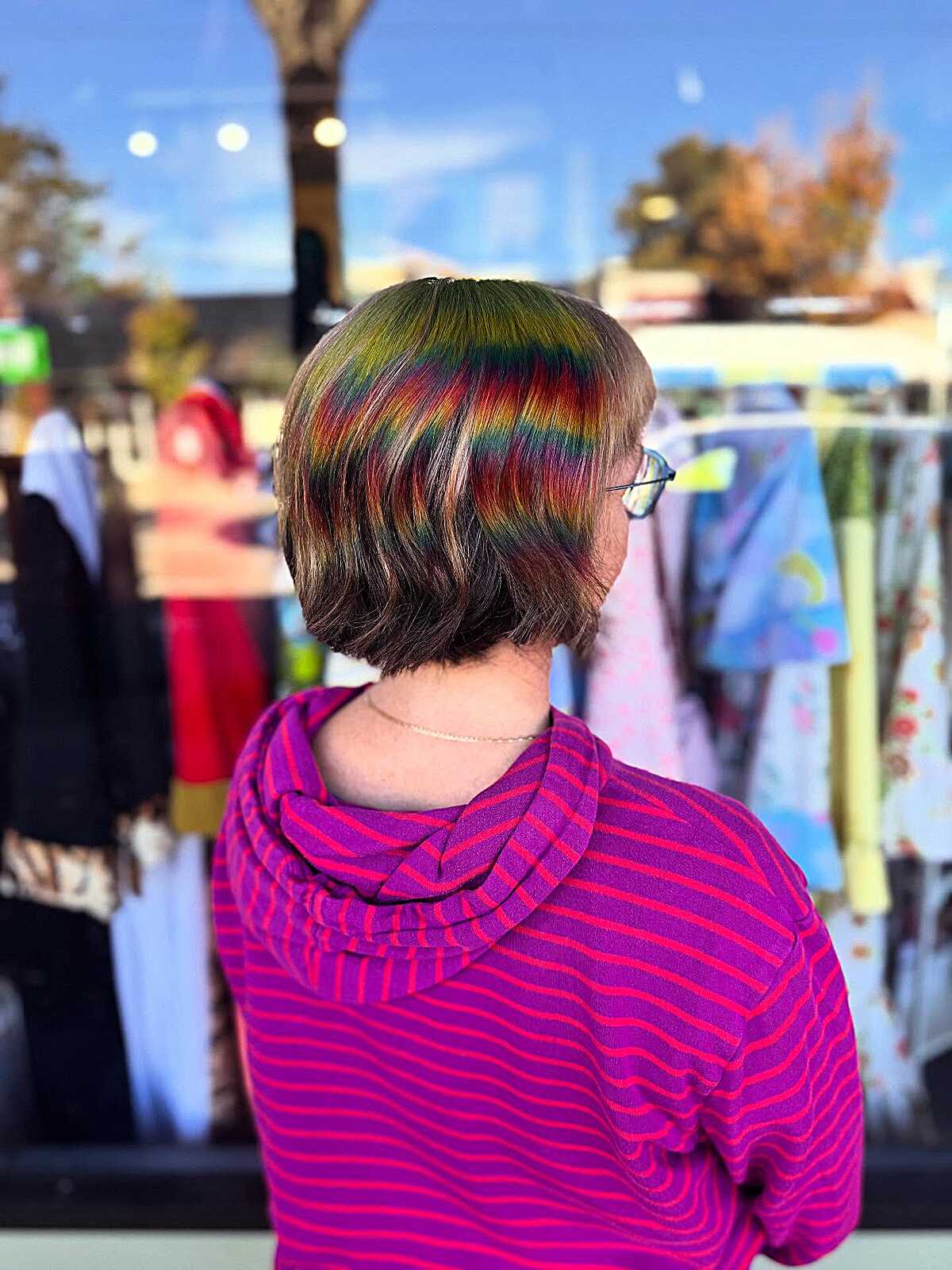 Short brown bob with hidden rainbow color stripe