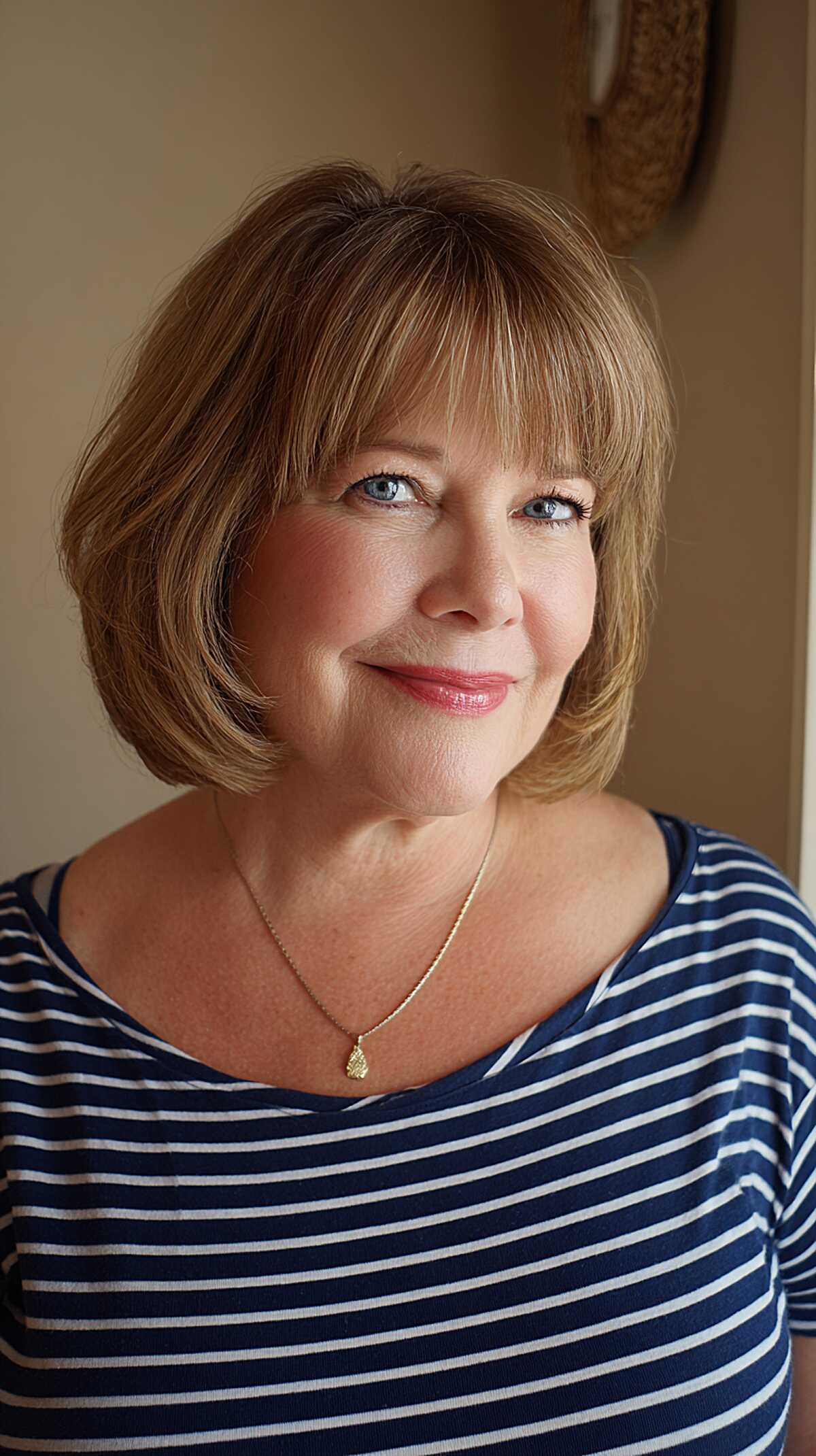 Honey blonde chin-length bob with full soft bangs