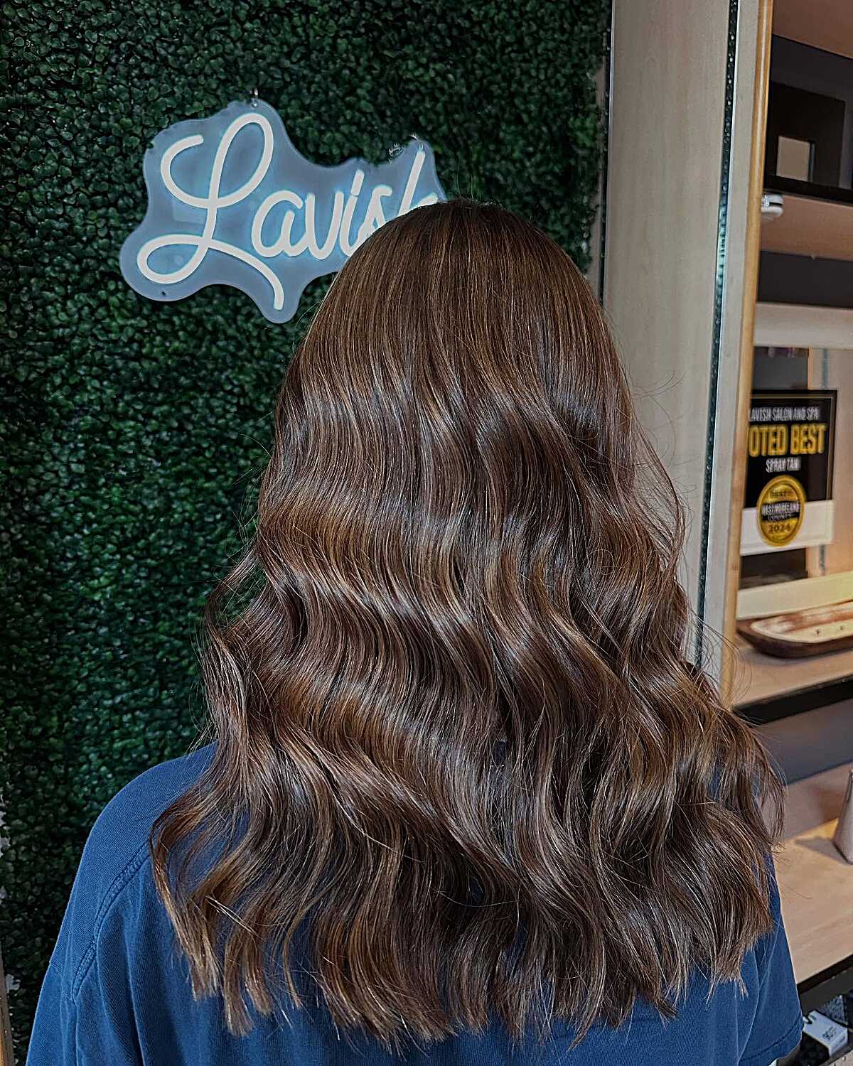 Warm brown waves with honey caramel dimensional color