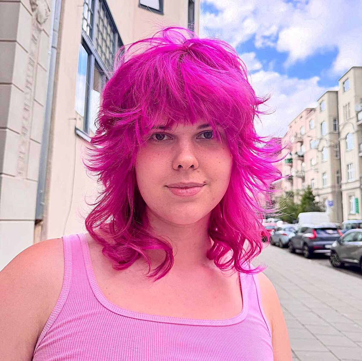Voluminous magenta pink shag with curtain bangs