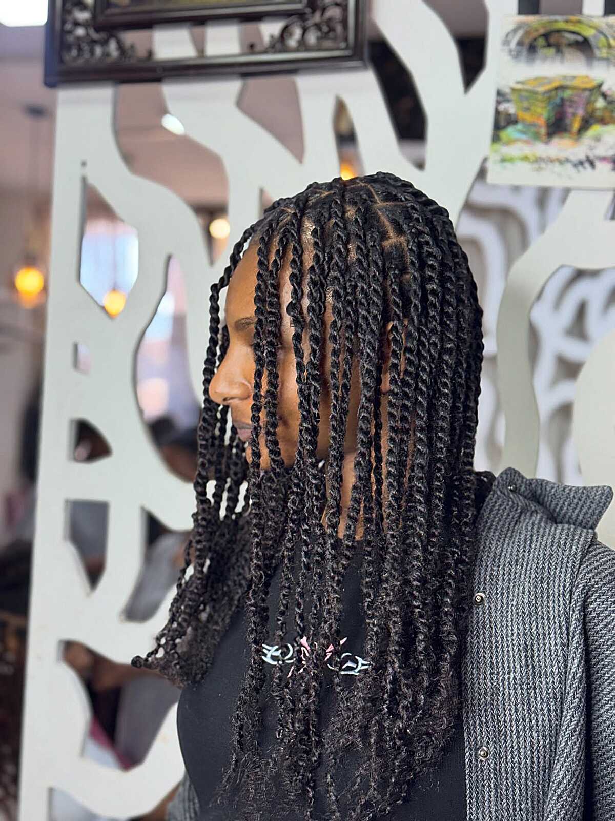 Black rope twists cut to shoulder length with layers