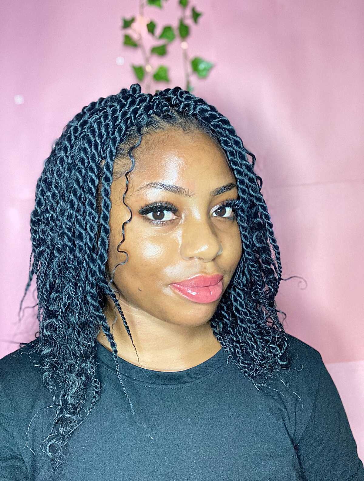 Dark blue-black shoulder-length twists with baby hairs