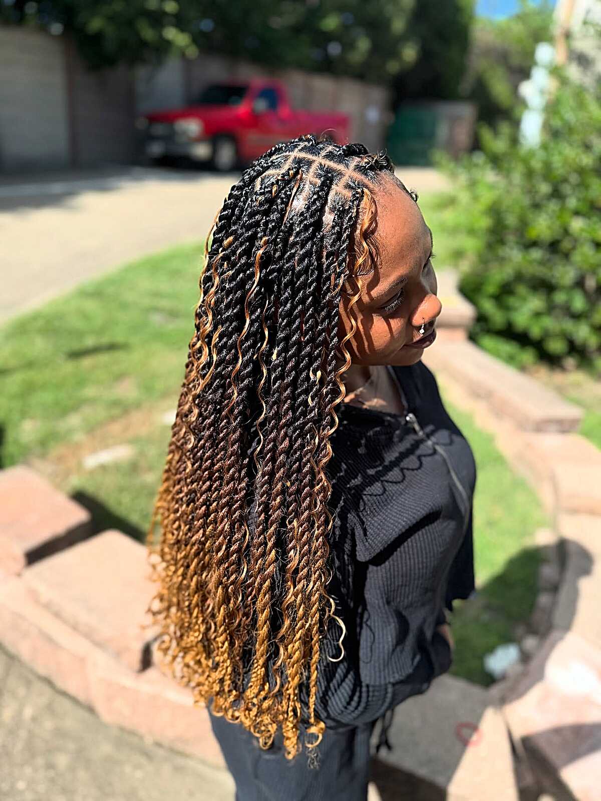 Black-to-honey-gold ombre twists with curly ends