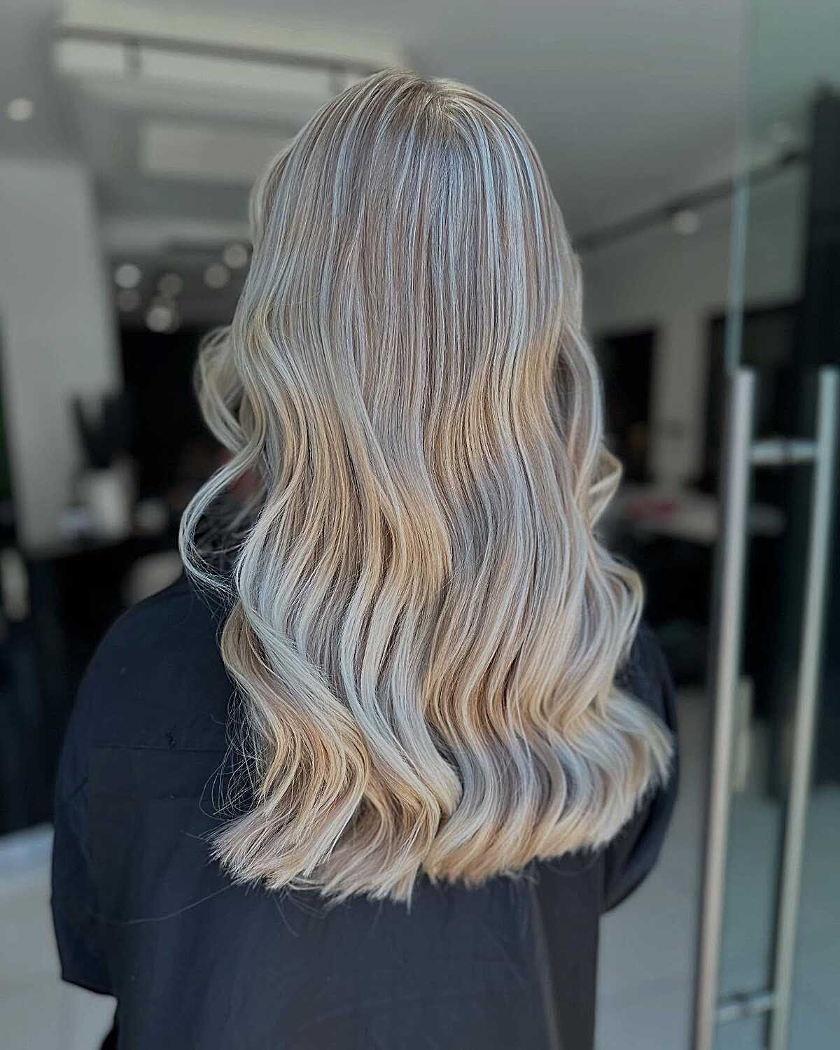 Medium length pearl ash blonde with polished body waves