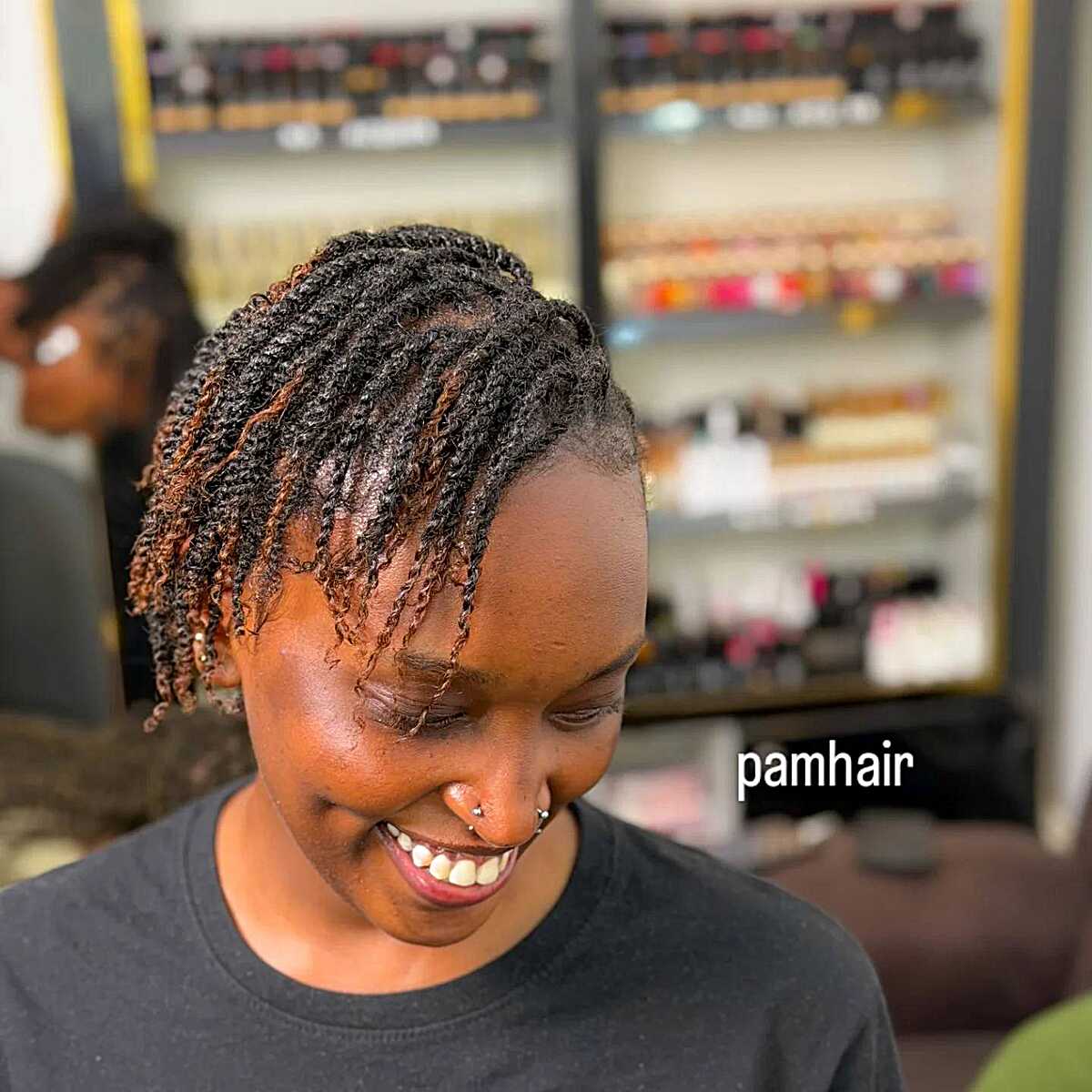 Short natural mini twists on short hair in a salon