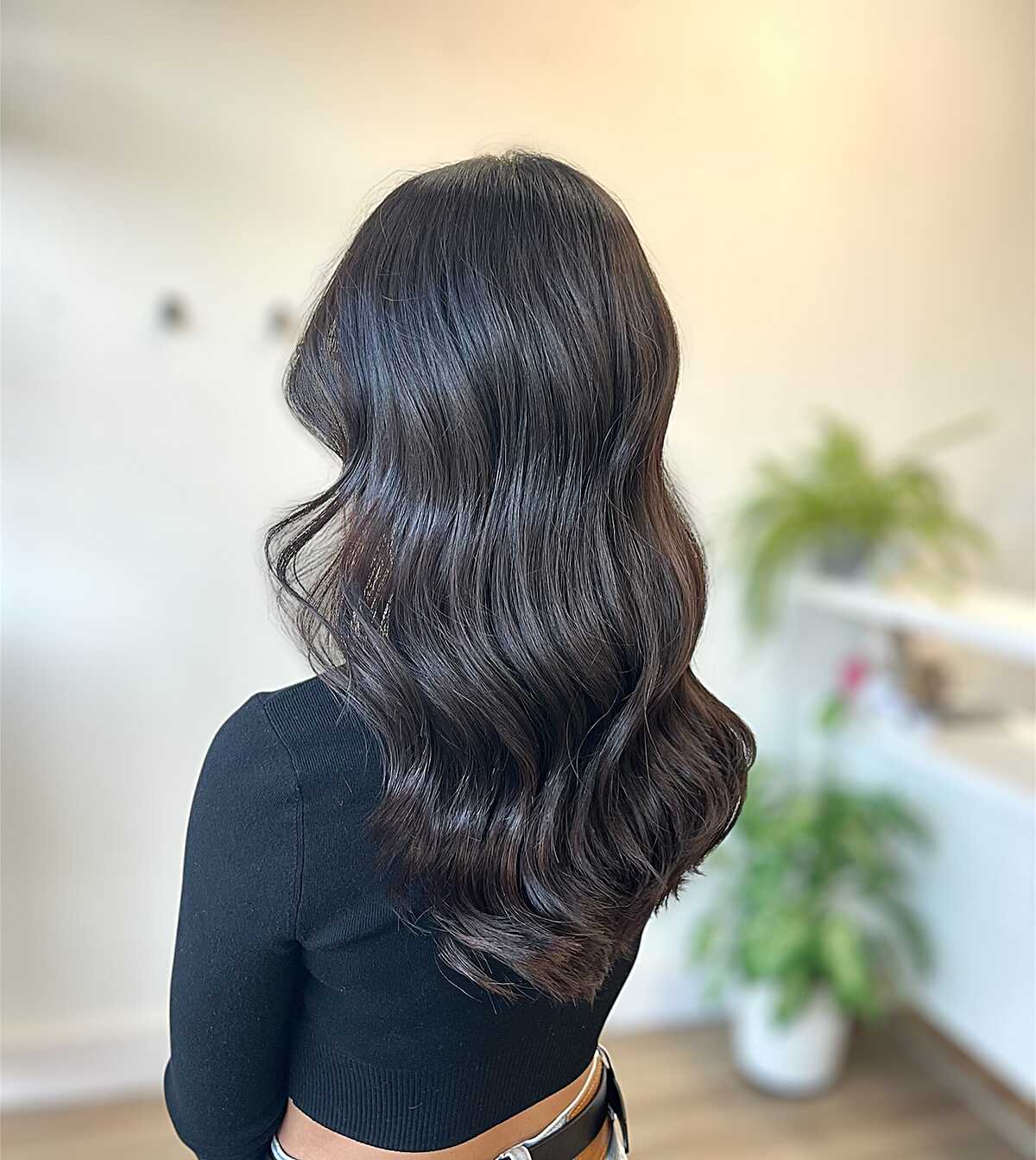 Medium-length dark espresso brunette with polished waves