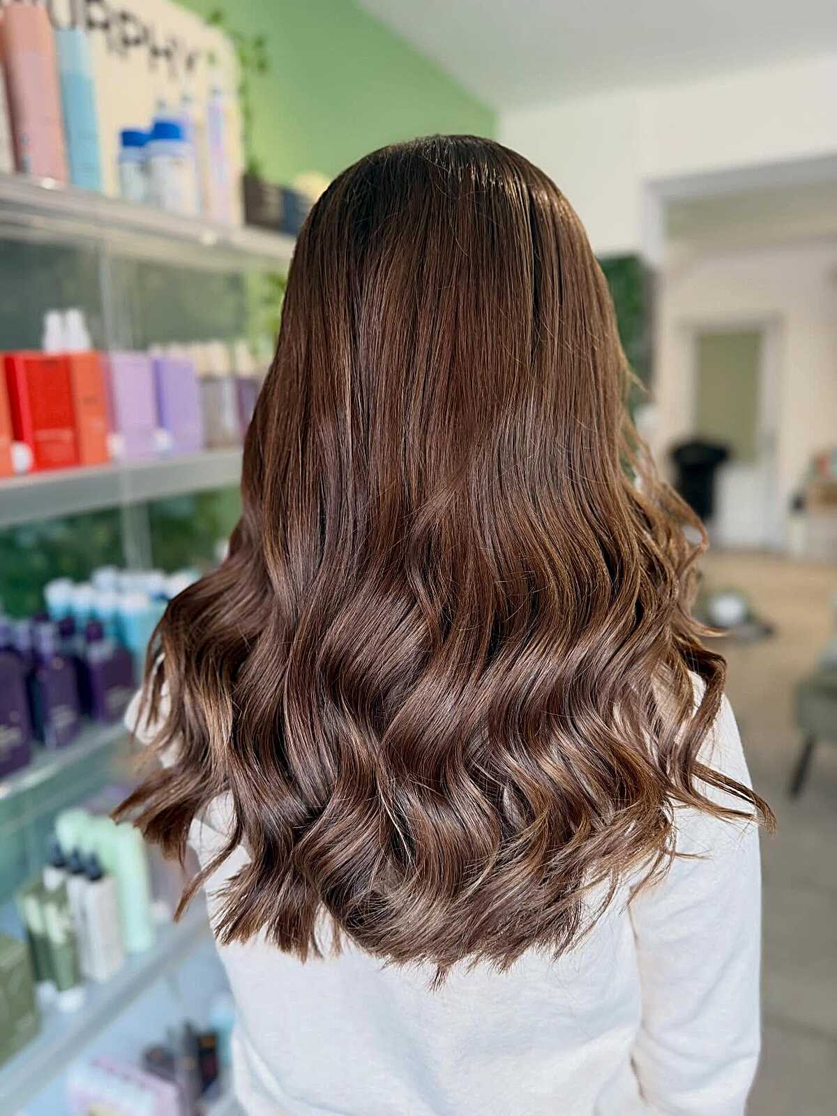 Polished hazelnut brunette with bouncy soft curls