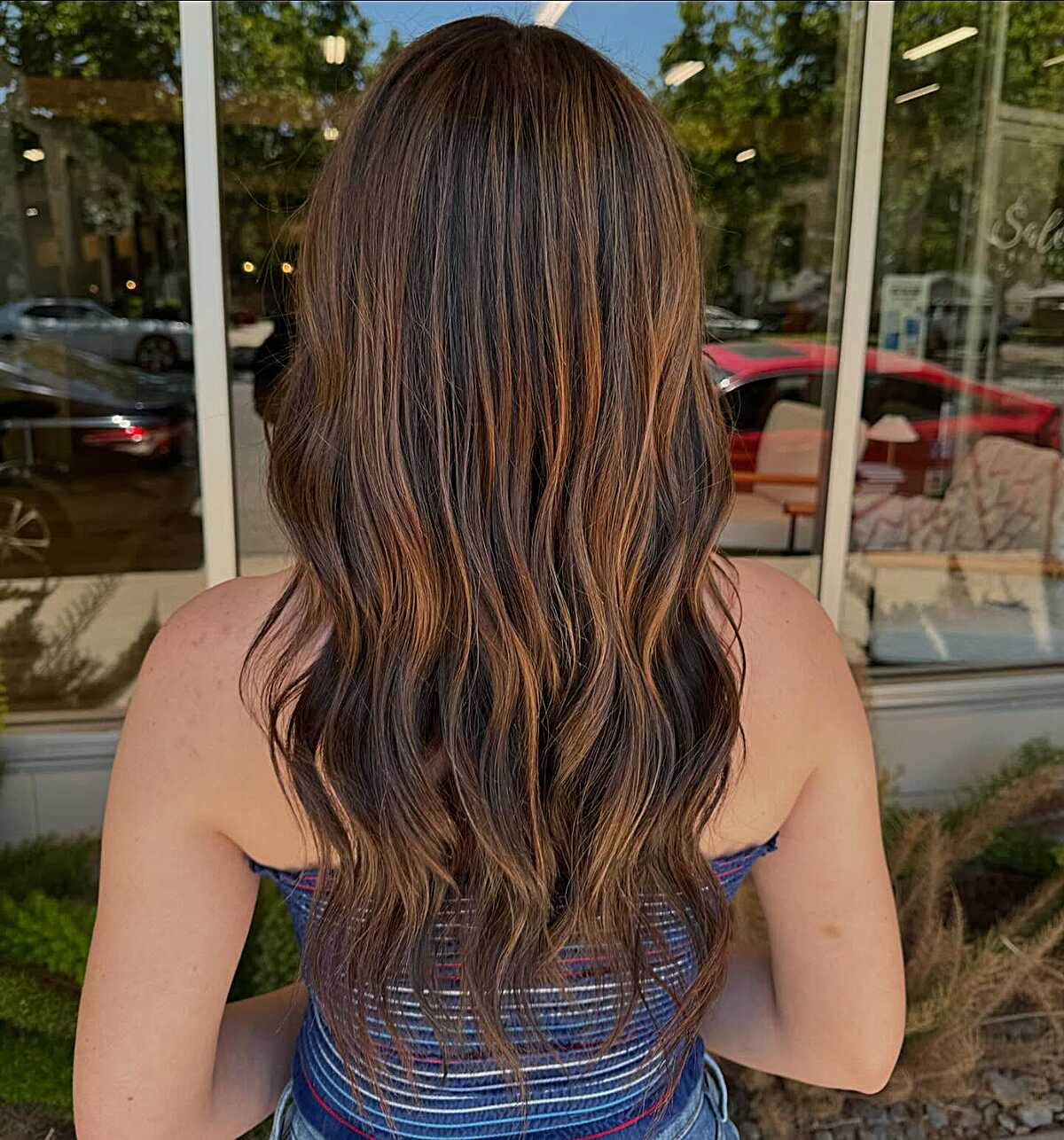 Long dark brunette with bold caramel ribbon highlights