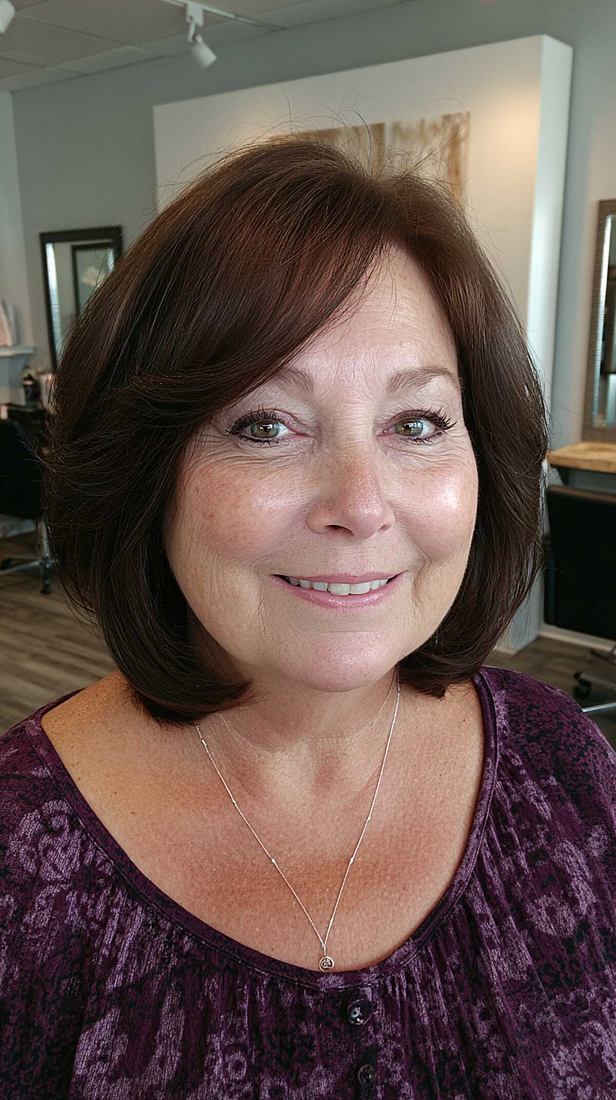 Dark brunette layered bob with feathered side layers
