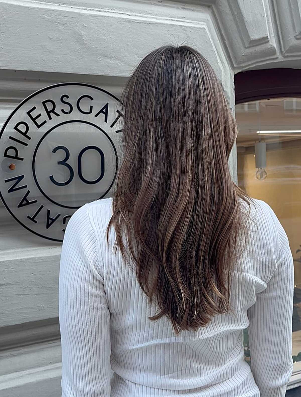 Long seamless chestnut brunette with soft natural layers