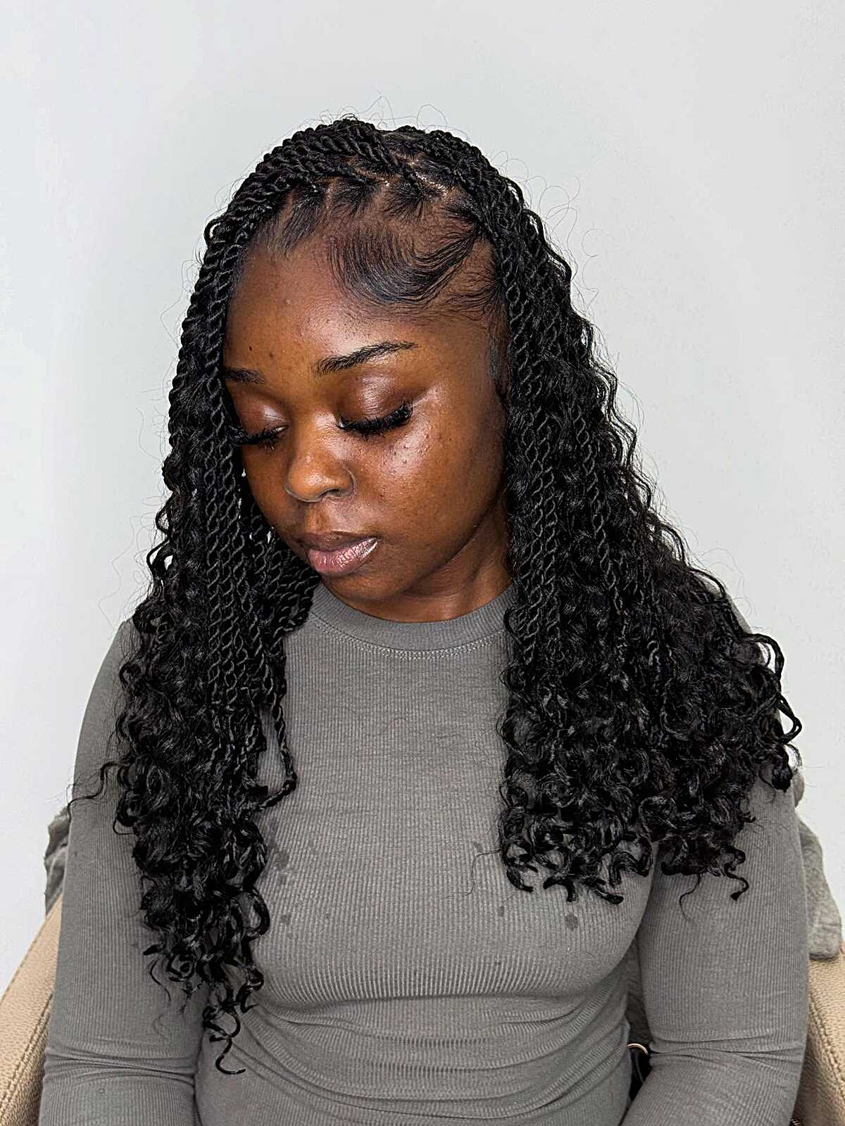 Shoulder-length black passion twists with full curls