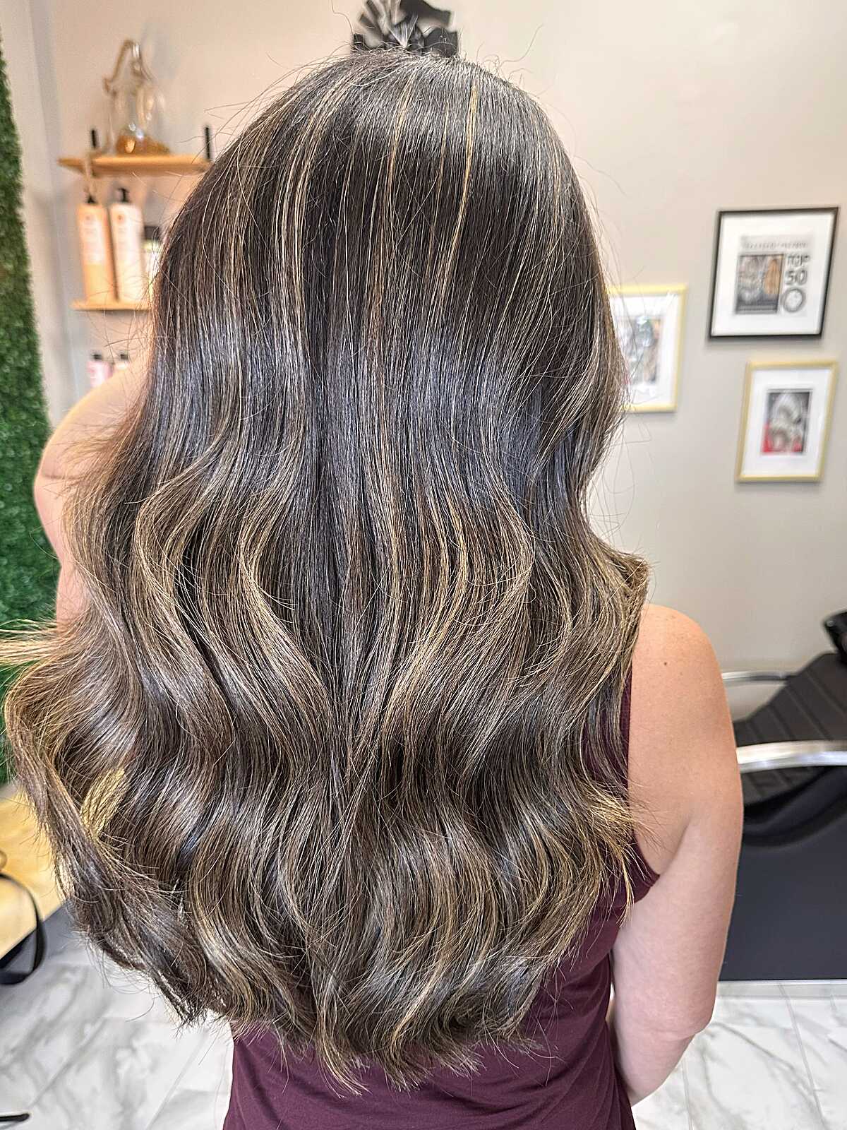 Long dark brunette with thin blonde highlights throughout