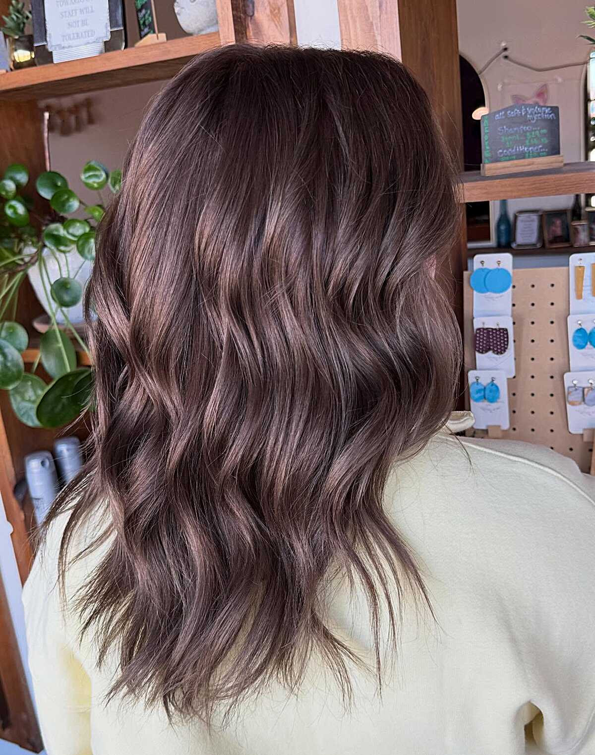 Medium brunette with smoky mauve-violet tonal shift