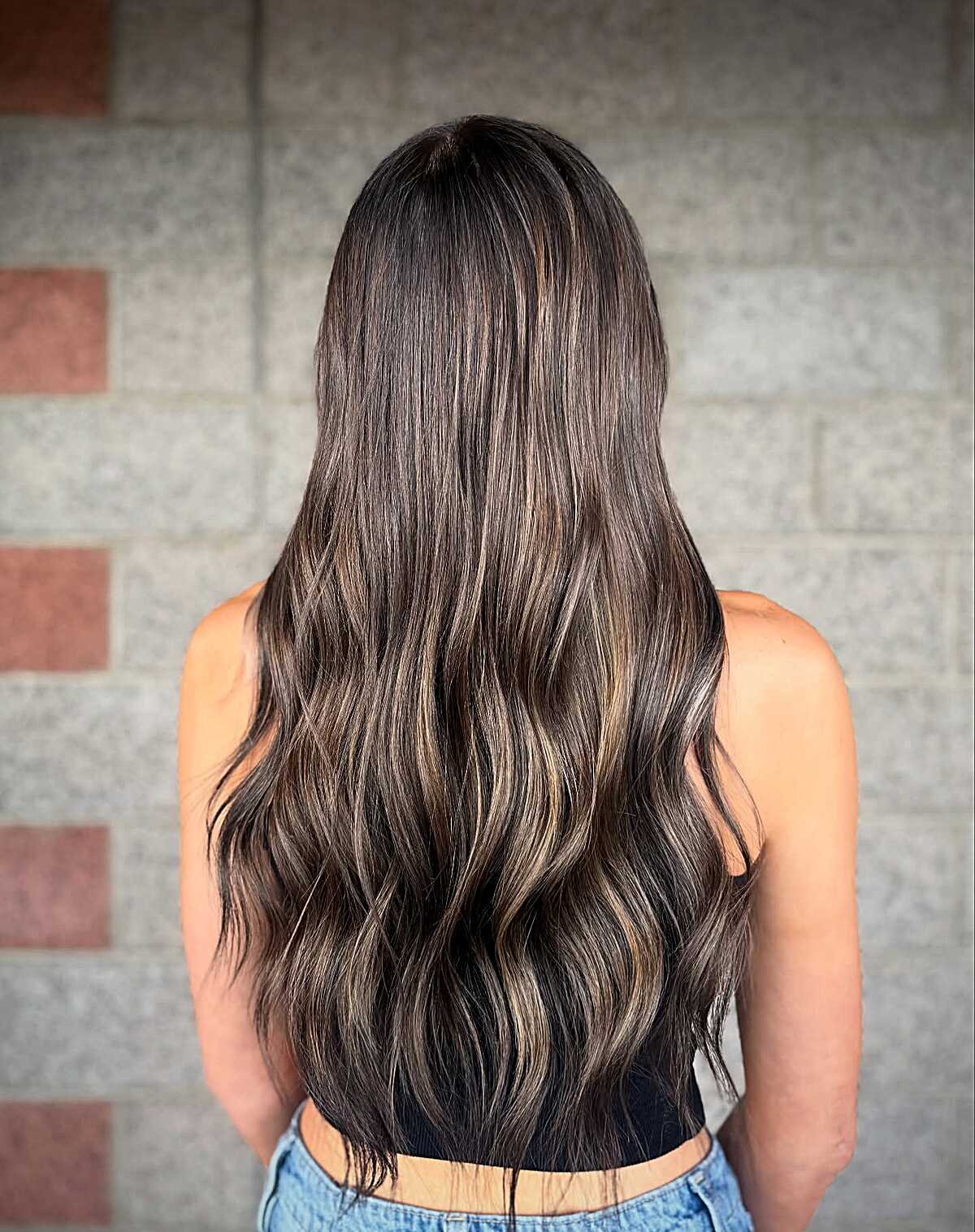 Long dark chocolate hair with fine honey-toned highlights