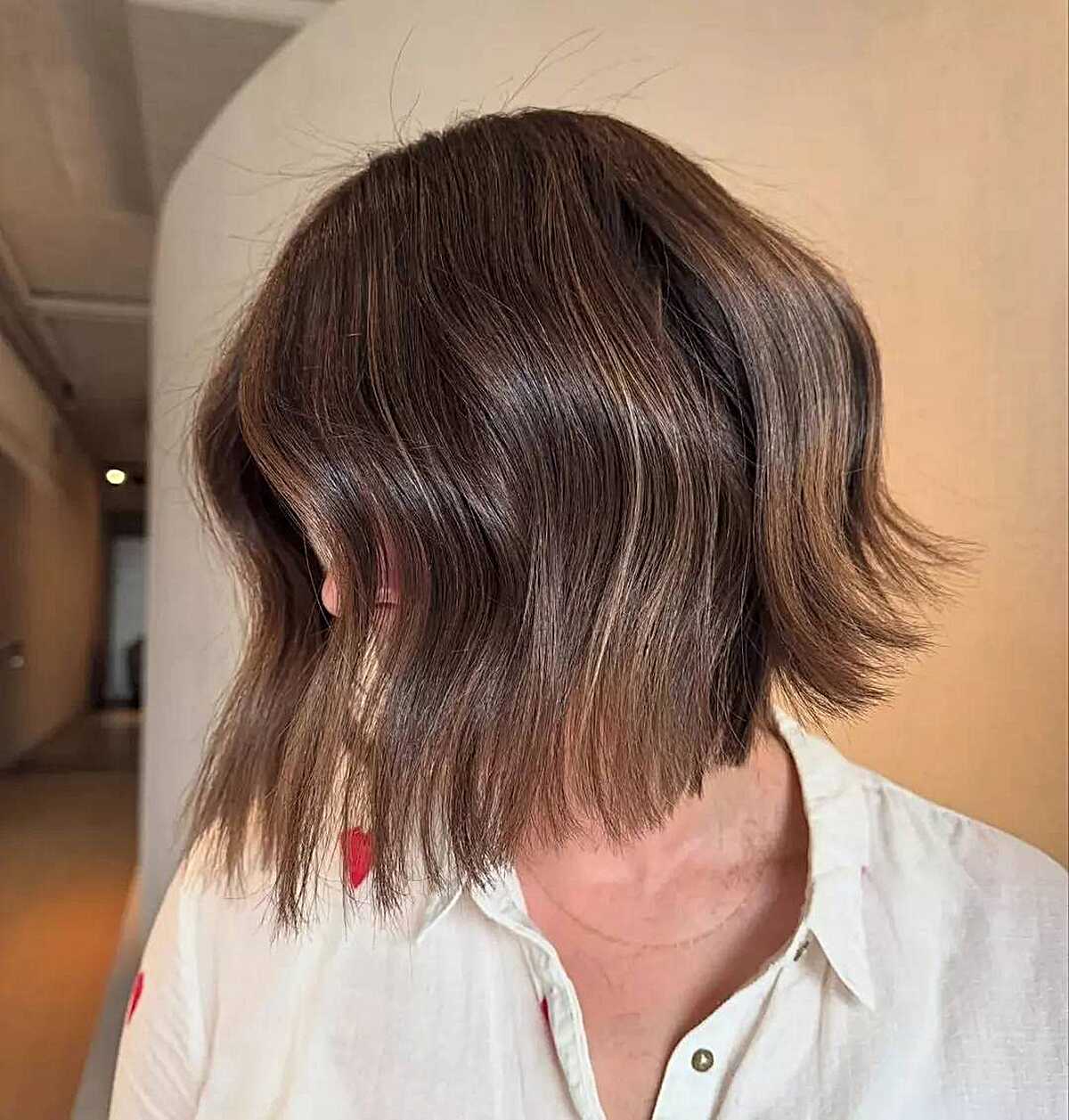 Short textured brunette bob with soft waves