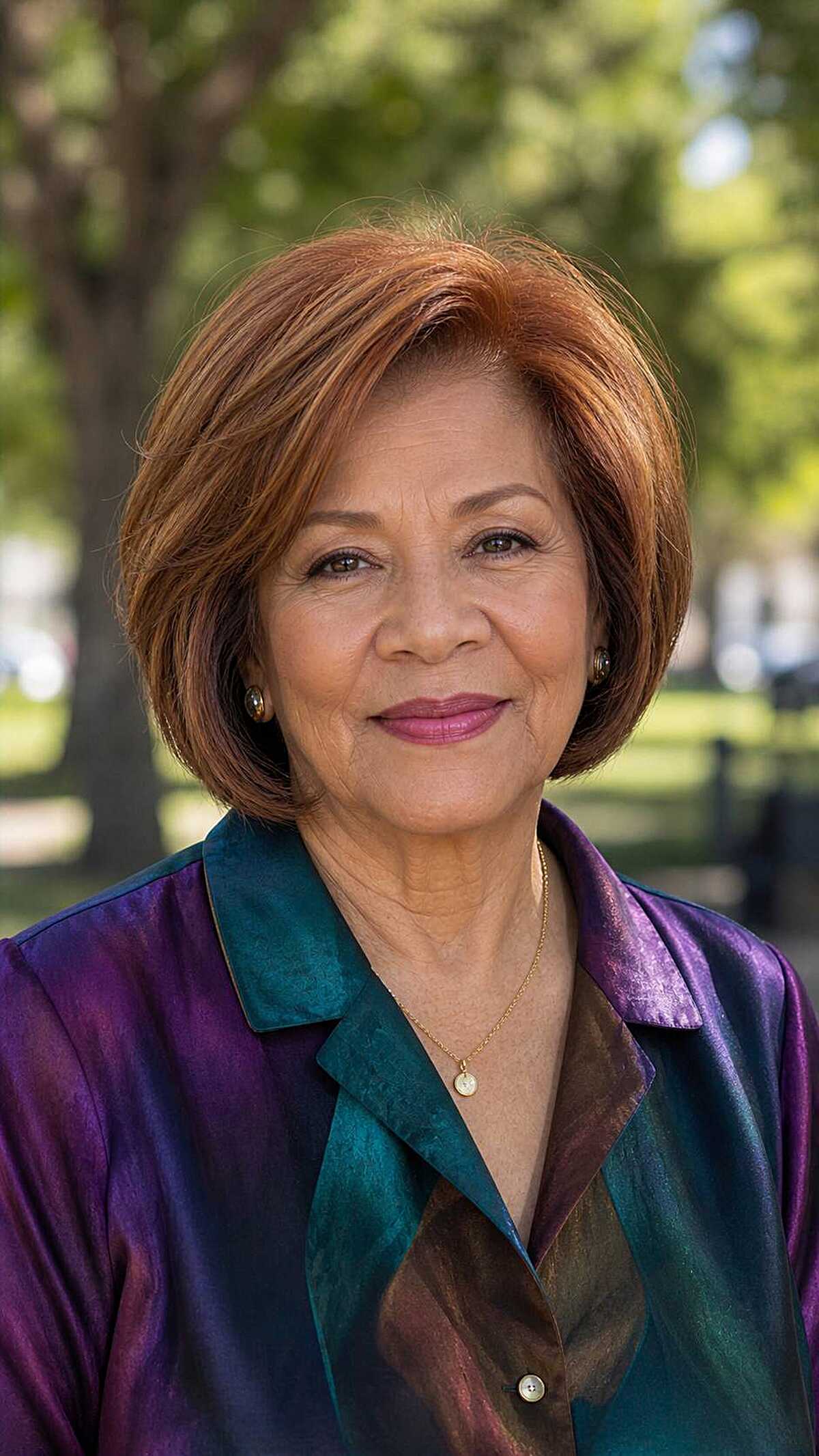 Rounded chin-length bob in warm copper auburn