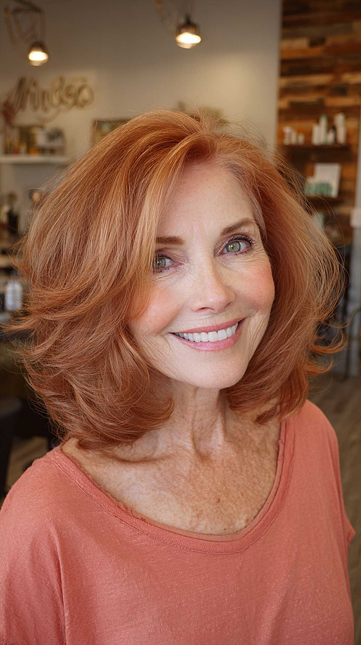 Vibrant copper red layered lob with volume