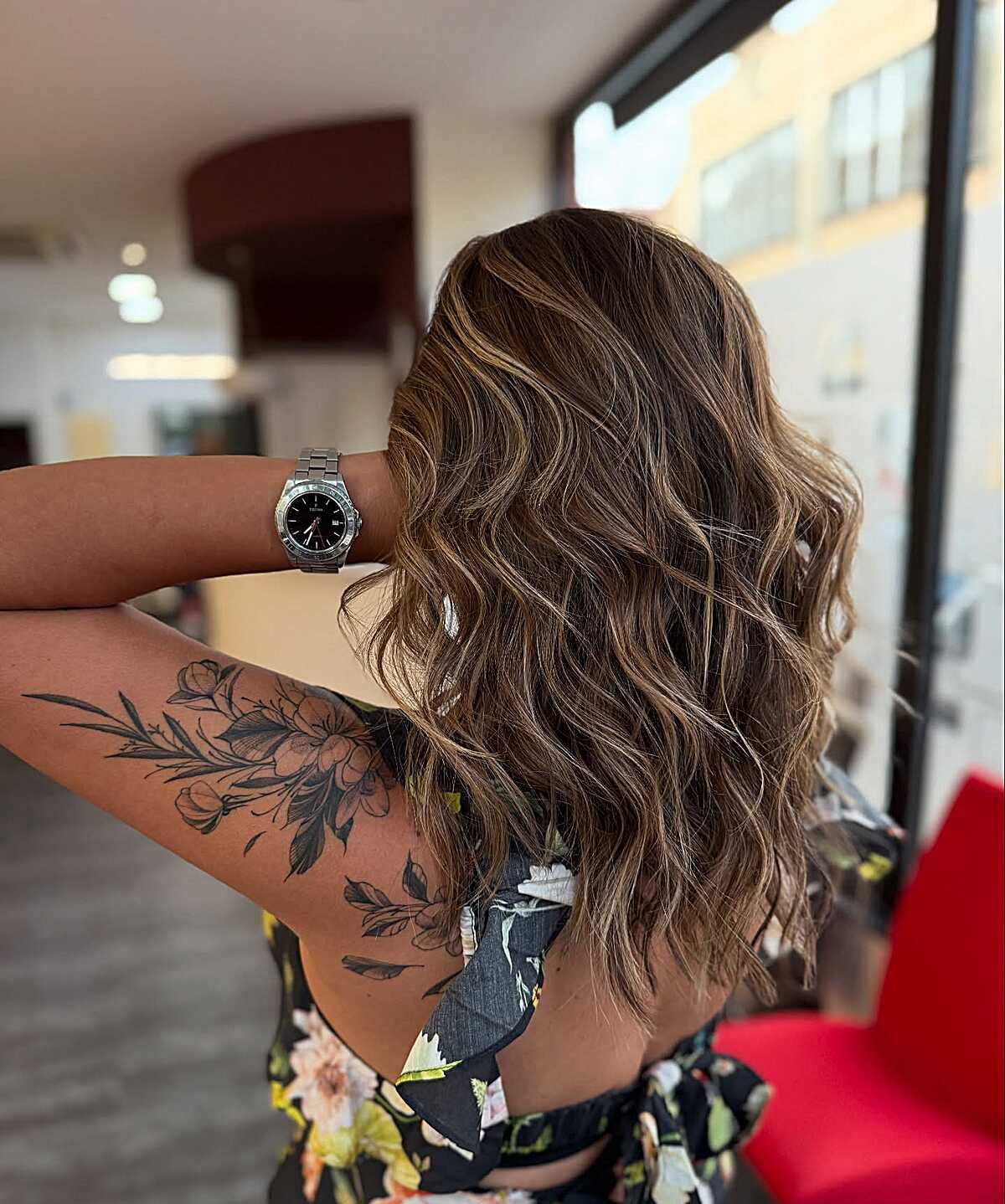 Medium wavy bronde hair with buttery blonde face framing