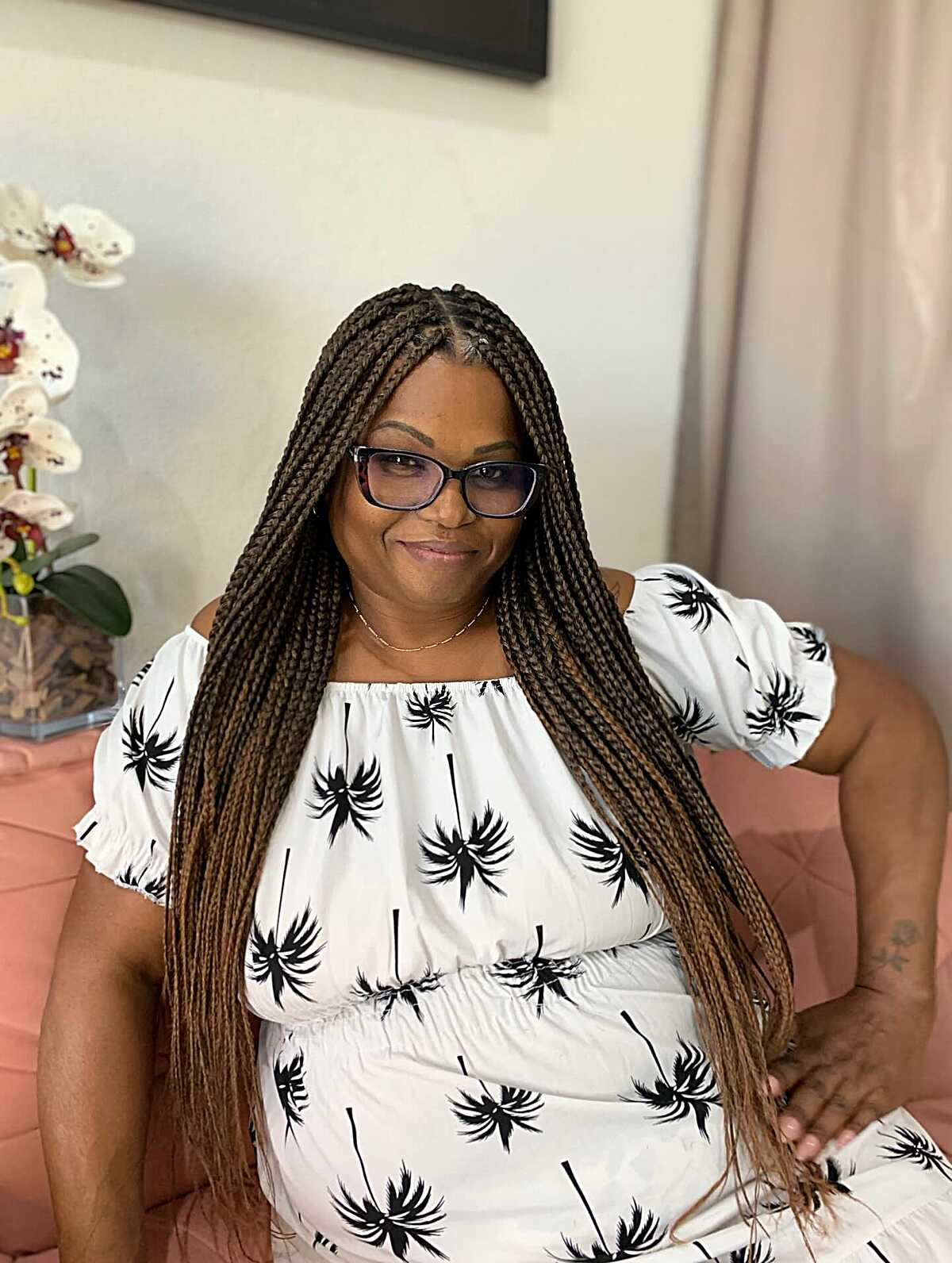 Long brown knotless box braids past the hip