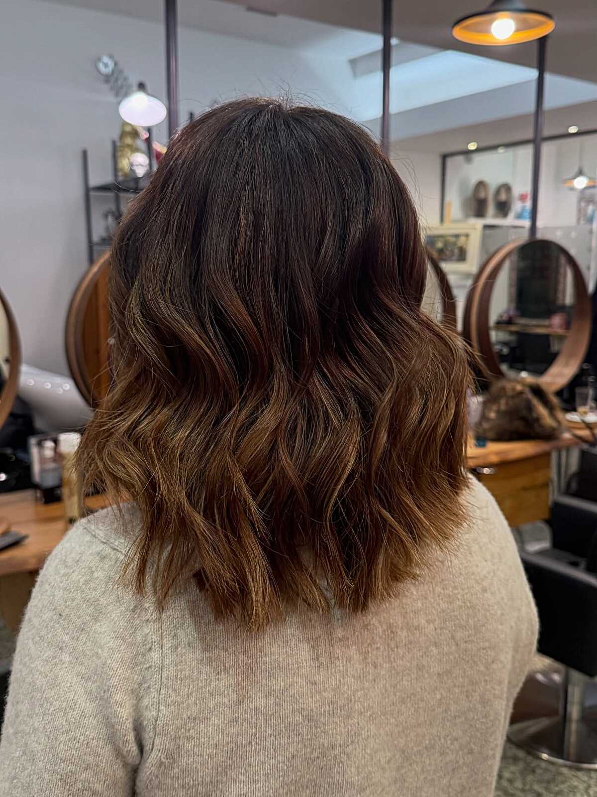 Chocolate brown lob with warm copper ombré at the ends