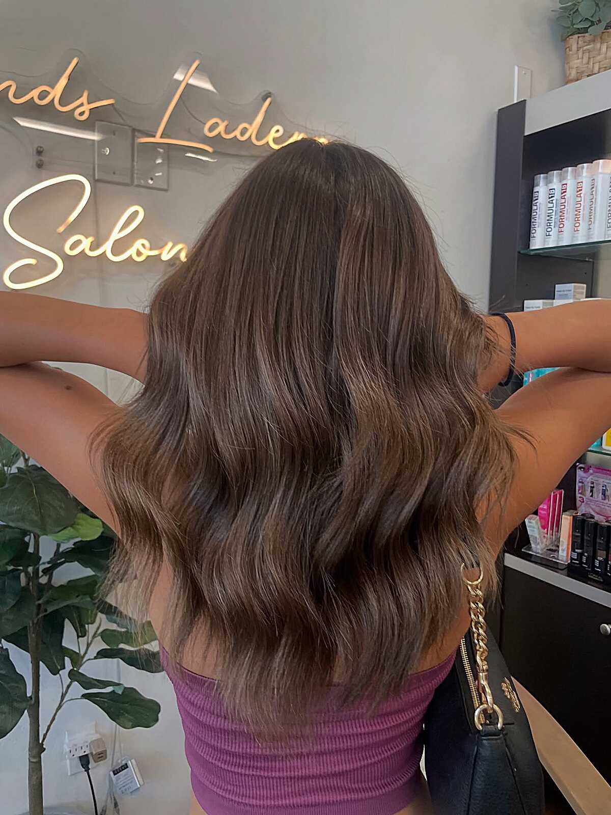 Medium warm walnut brunette with soft lived-in waves