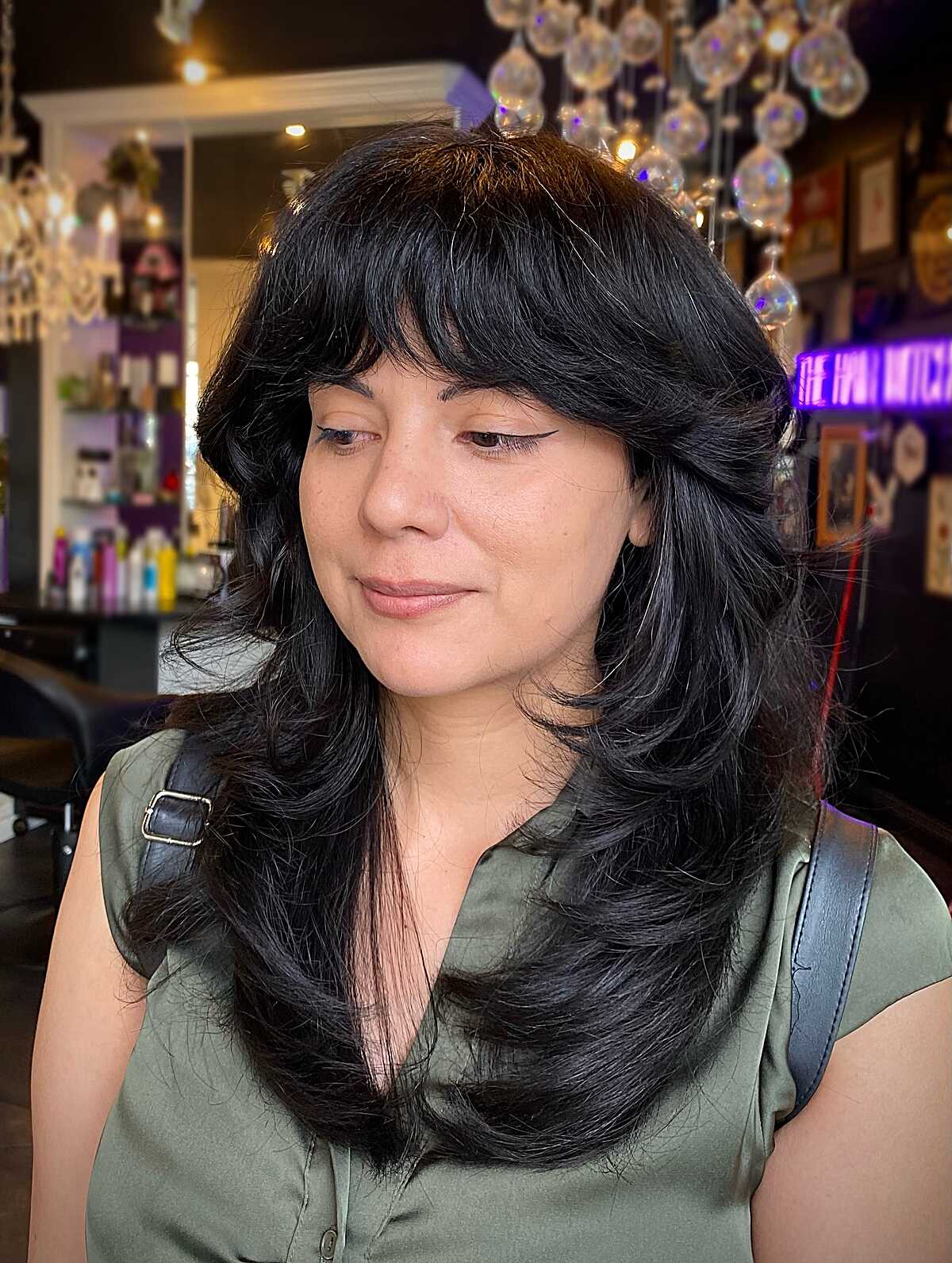 Jet black long butterfly layers with heavy bangs