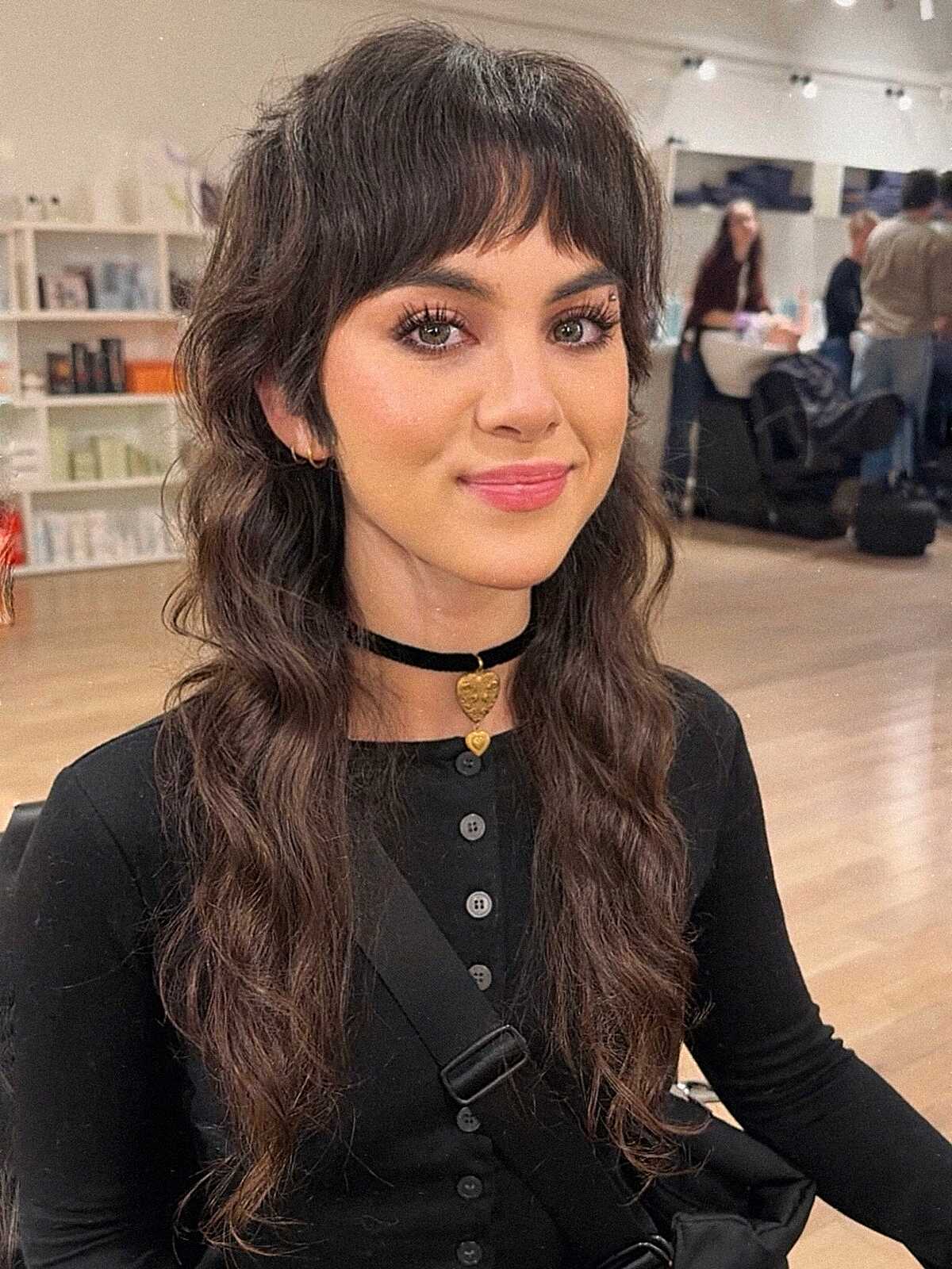 Dark brunette long wavy hair with soft peek-a-boo bangs