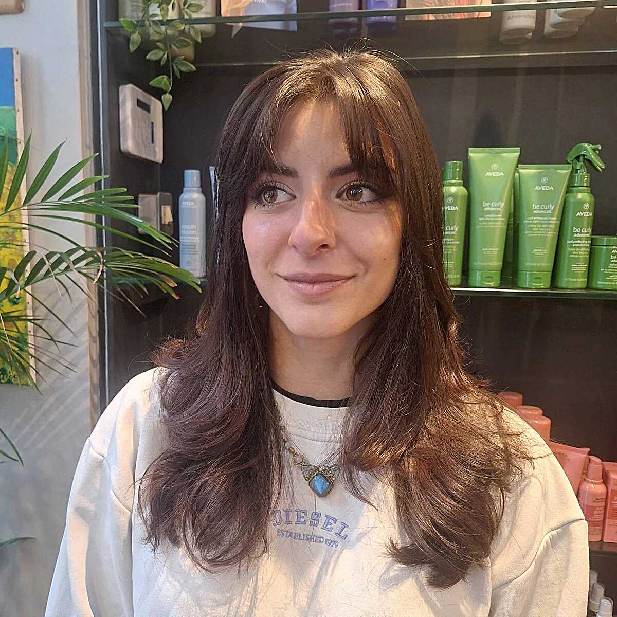 Natural brunette long hair with soft wispy bangs
