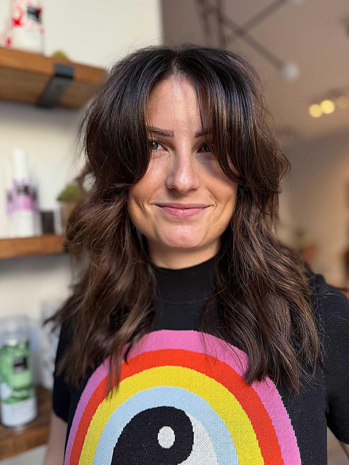 Chocolate brown wavy layers with tousled curtain bangs