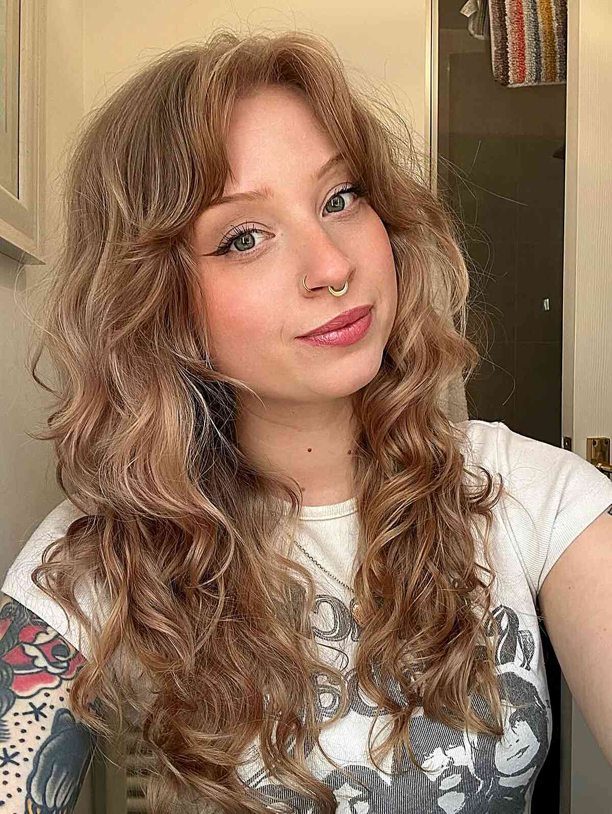 Textured Wavy Hairstyle with Curtain Bangs