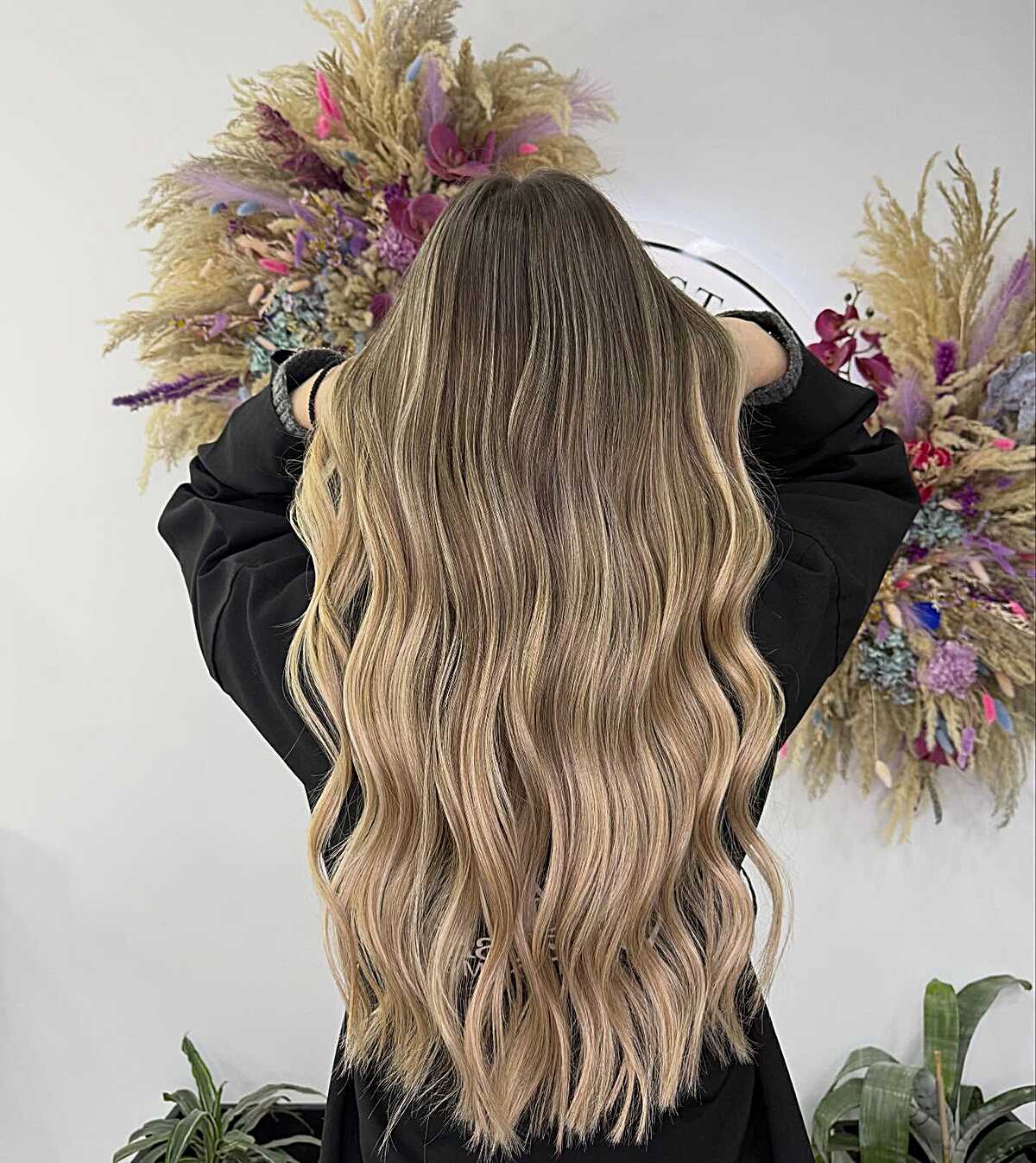 Extra long dirty blonde balayage with soft waves