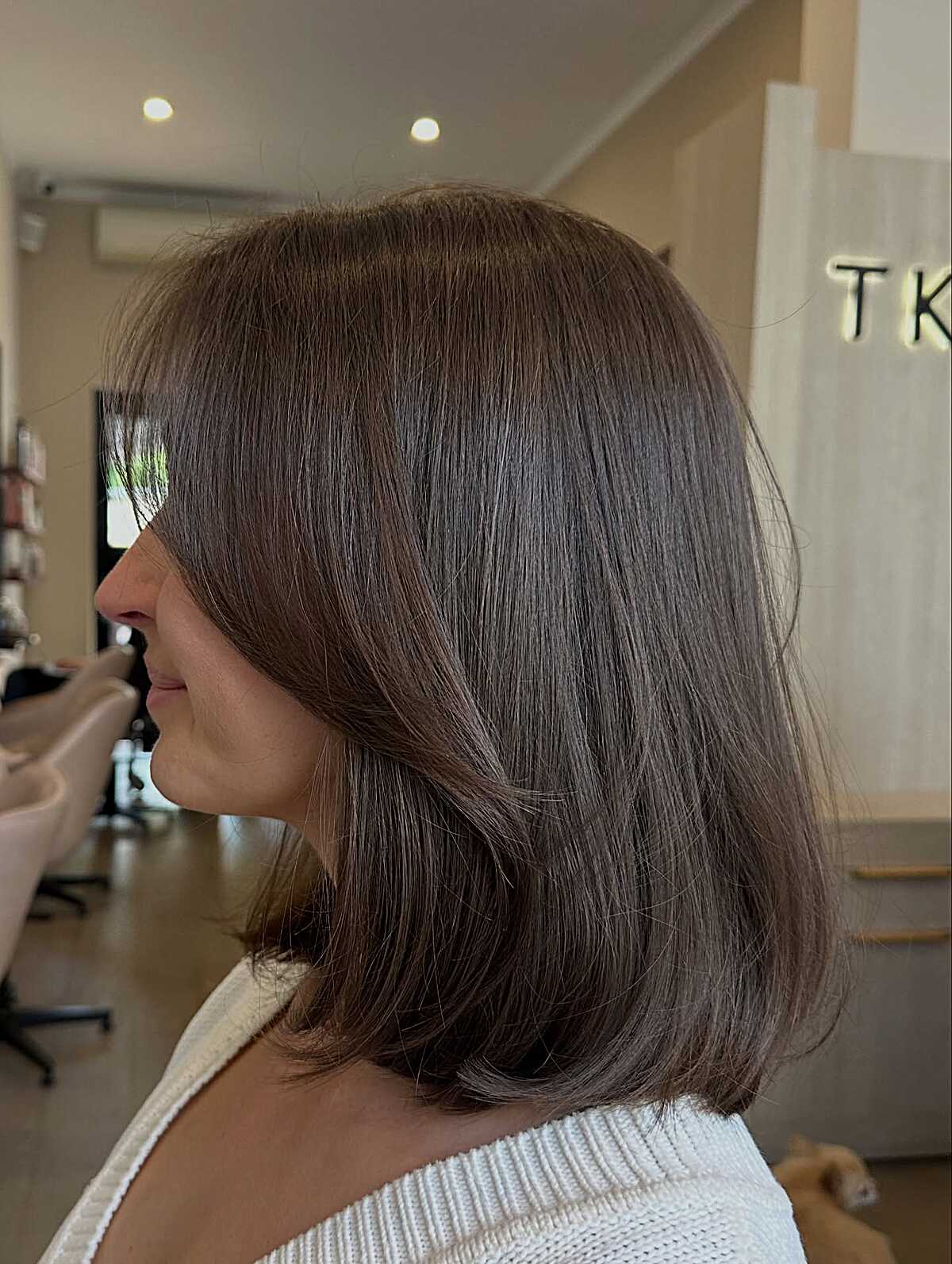 Brunette lob with flipped ends and invisible layers