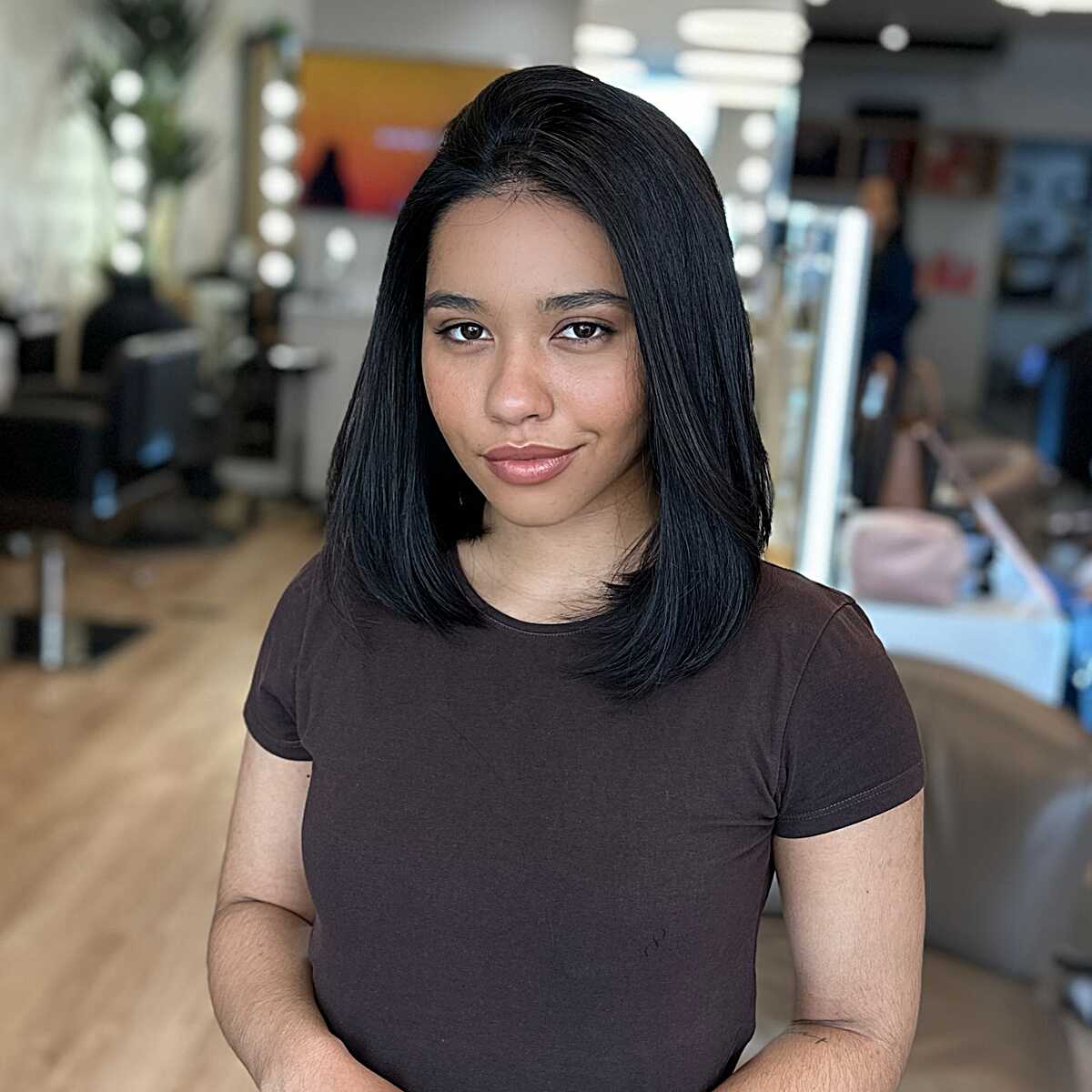 Jet black sleek straight lob at collarbone length